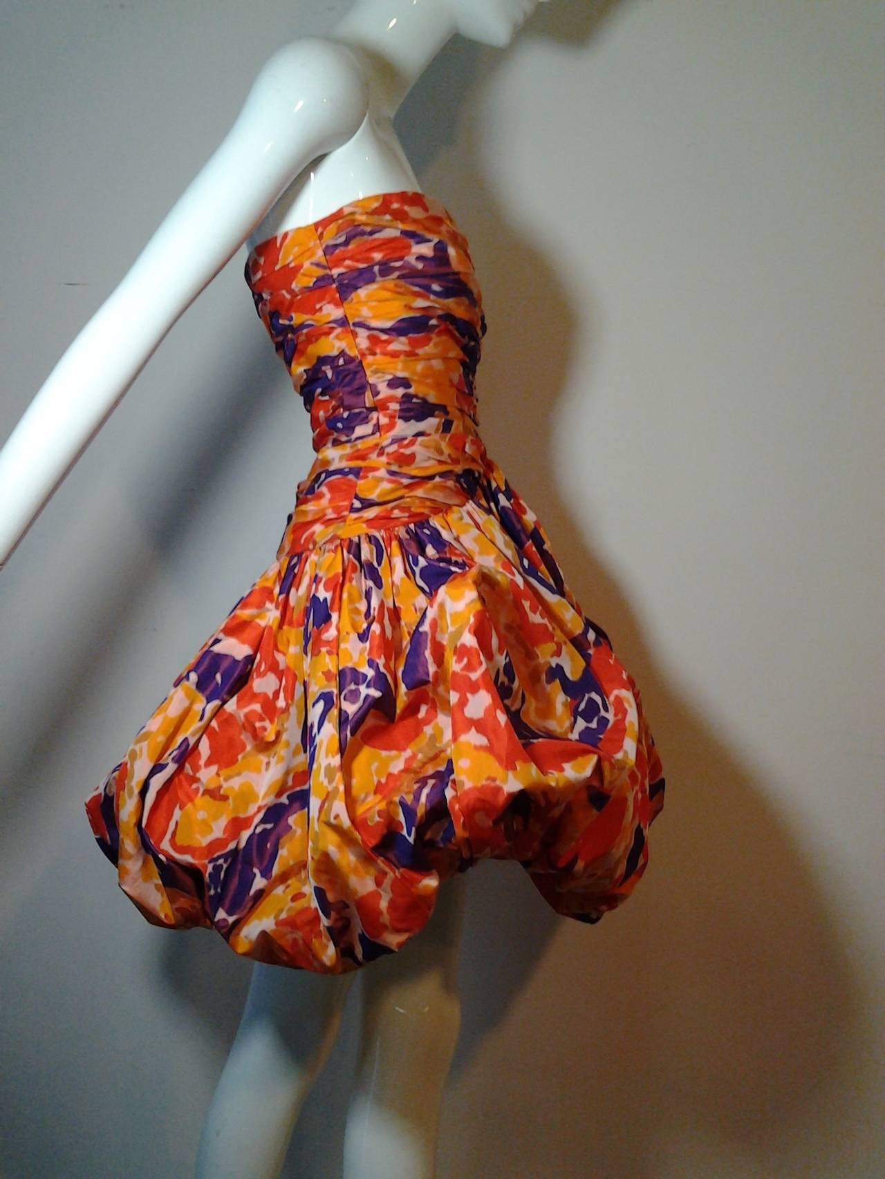 Fabulous 1980s Bill Blass strapless silk floral print pouf dress.  Back zipper and stays.