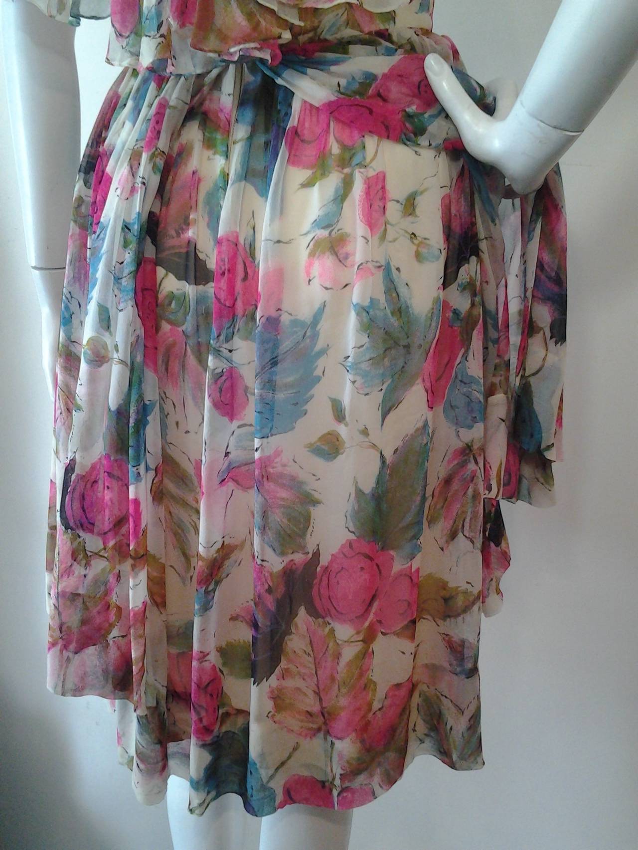1950s unlabeled Suzy Perette style silk chiffon floral print cocktail dress with full skirt, ruched and draped bodice and flowing back caplet.  Skirt has two layers of print chiffon with lining.