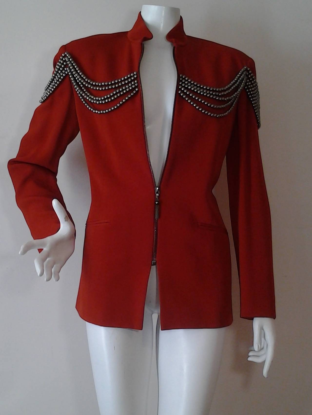 1990s Rifat Ozbek Nehru collar, front zip, military-inspired jacket in cinnabar rayon. Festooned at the shoulders with copper toned resin beading.