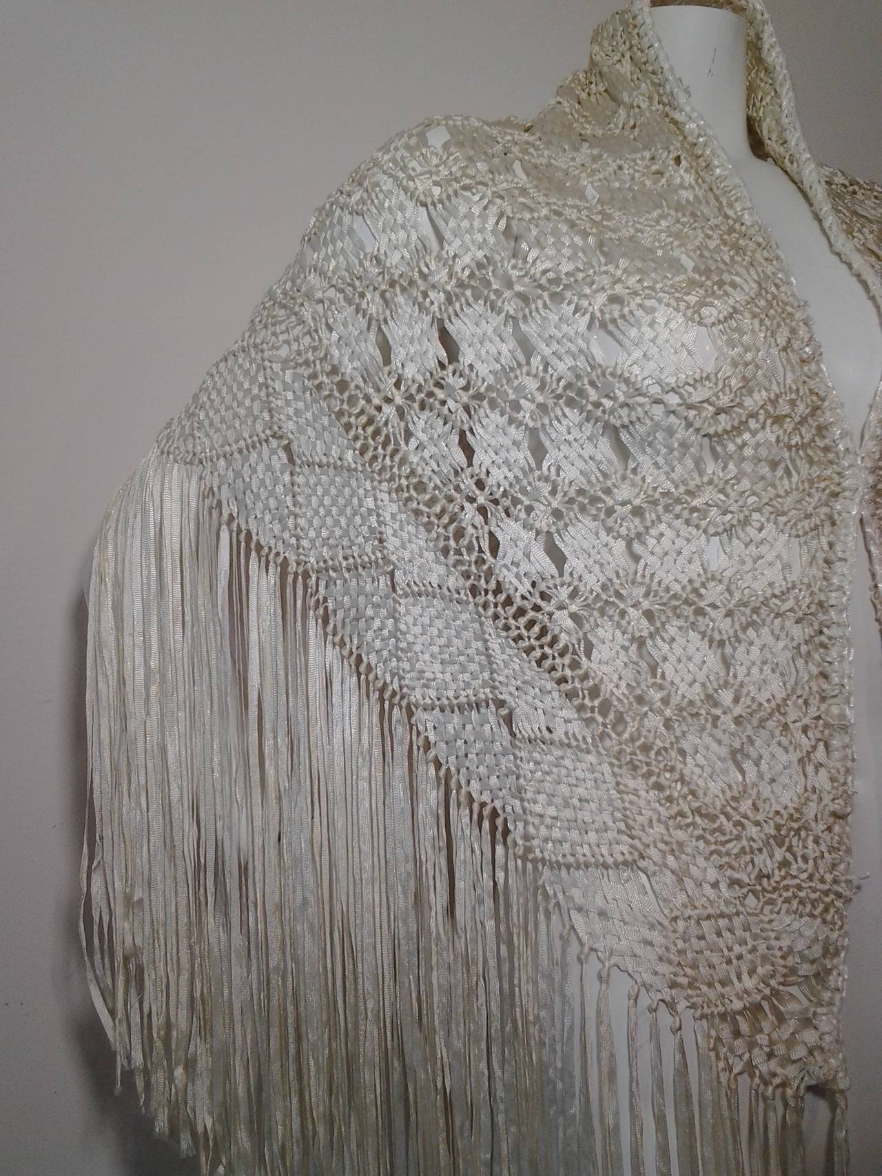 1970s white rayon ribbon macramé fringed shawl.