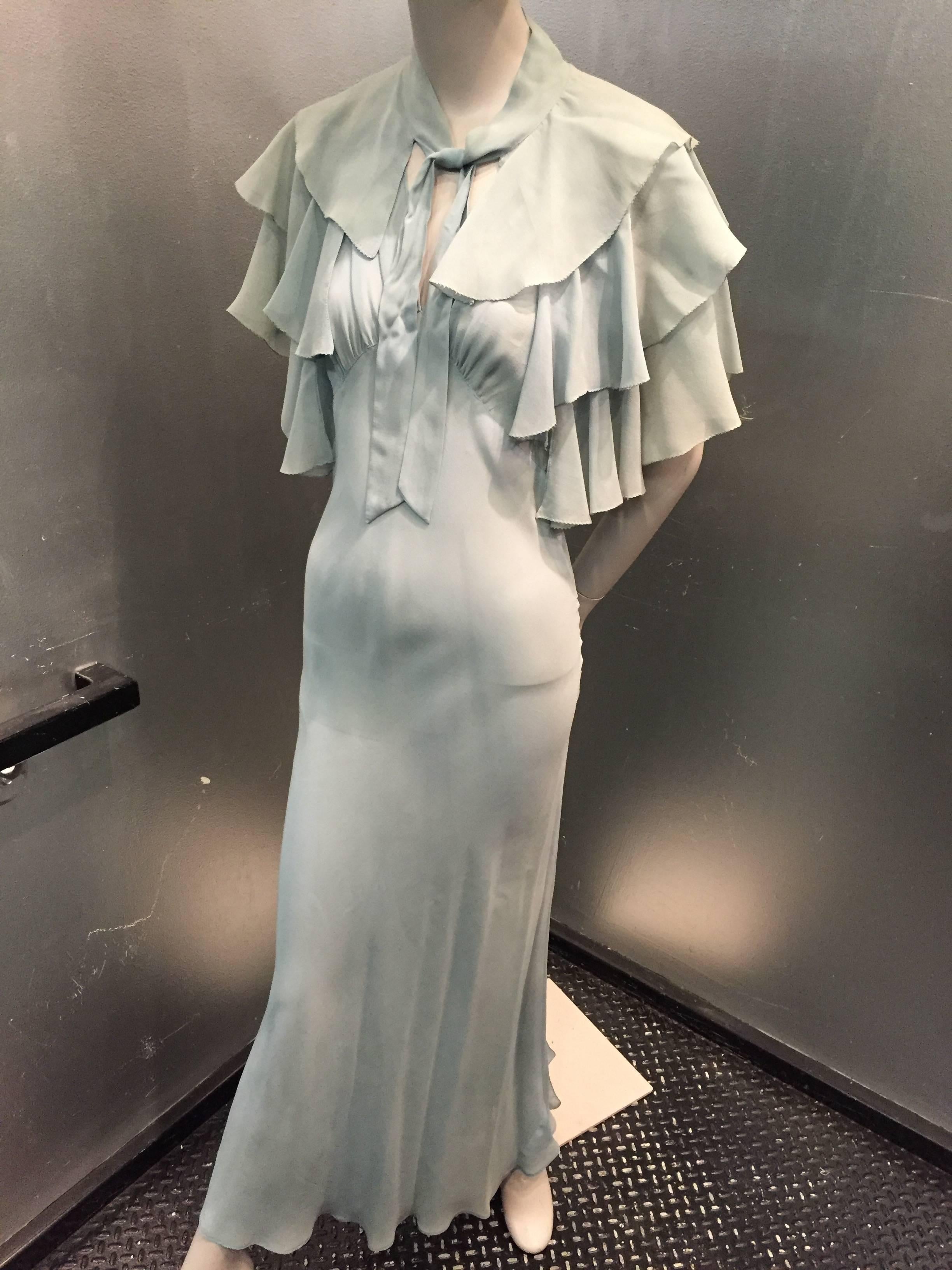 1930s Classic neglige-style powder blue silk chiffon bias-cut gown with tiered ruffled caplet:  gown is gathered at shoulders and has a cascading tiered ruffle back panel. Side snap closures. 