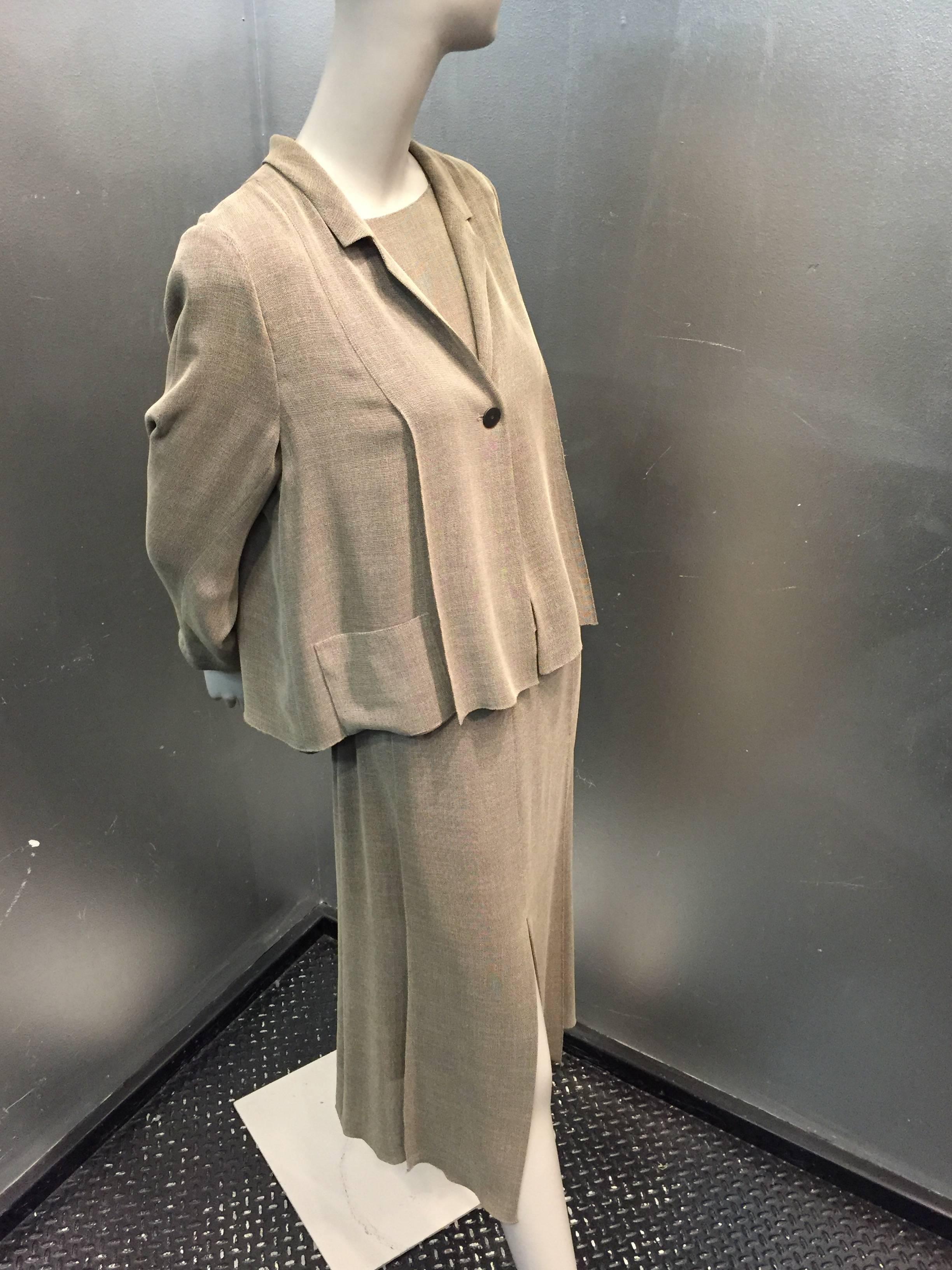 1990s Chanel loden-green summer 3-piece skirt suit:  A lightweight open-weave rayon crepe set.  3-Button back shell, back pleated swing-style jacket with front pockets, notched lapel, 