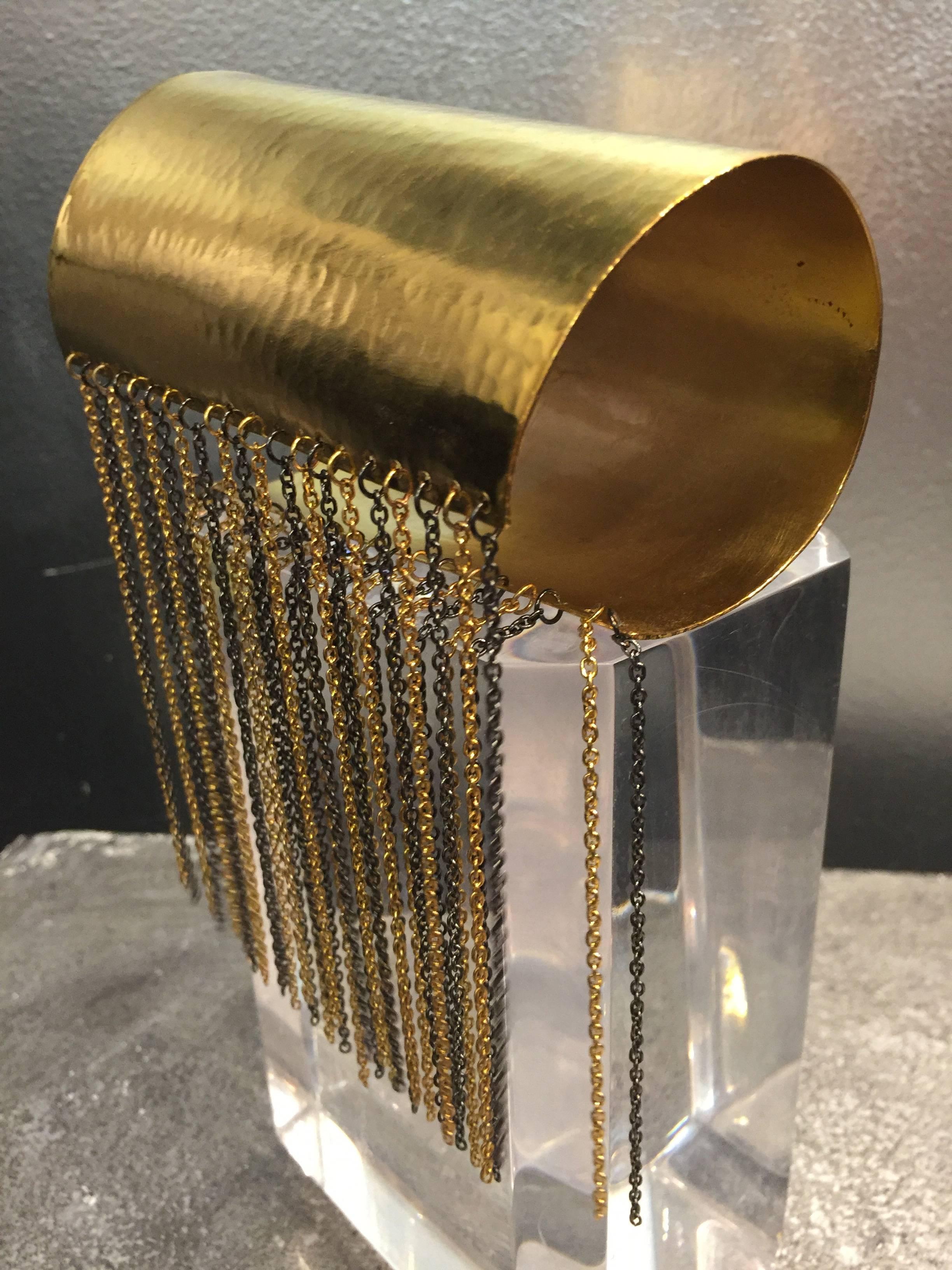 1980s Hammered gold-tone cuff with gold and pewter-tone chain fringe. 