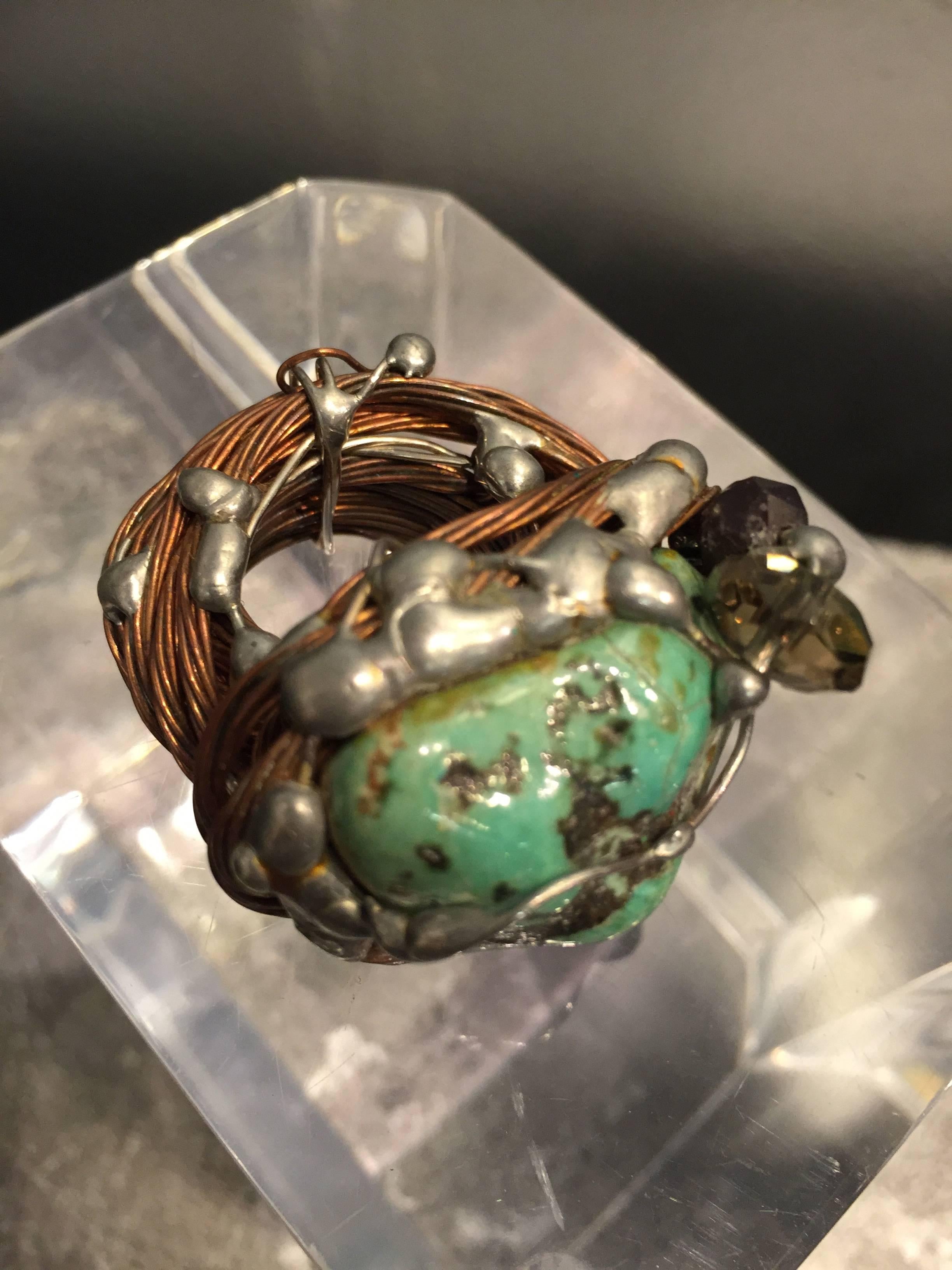 A bold and unusual 1970s hand-crafted copper wire and turquoise center stone ring.  Soldered together. Approx. 6.5-7.