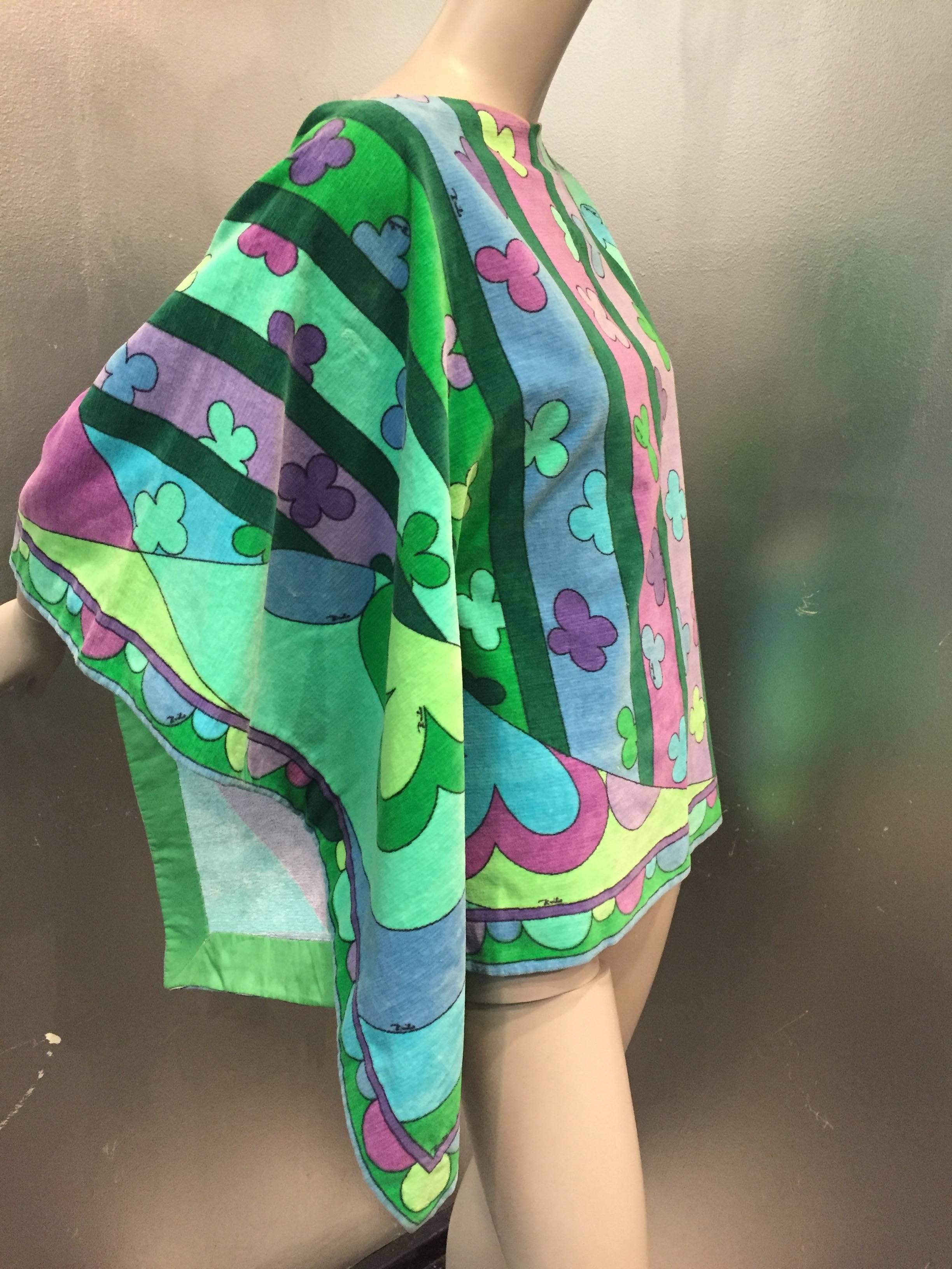 A fabulous 1960s Emilio Pucci cotton velveteen poncho in Pucci's signature print style. Snap closures at side. 