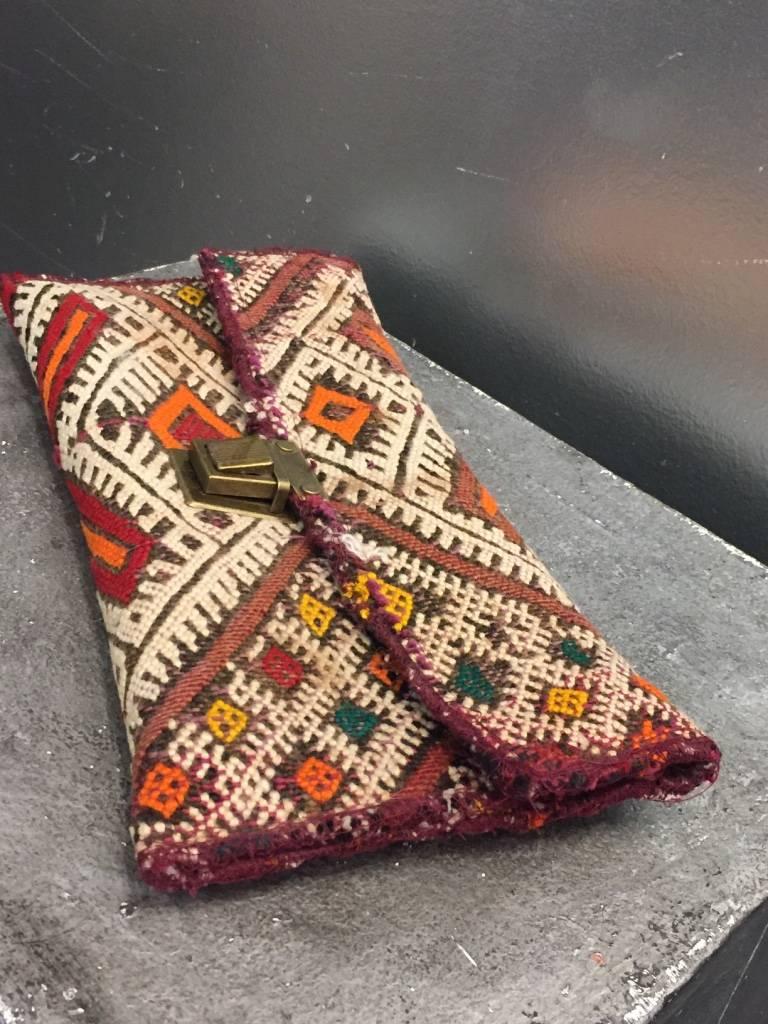 1940s-Style Moroccan antique textile clutch with heavy brass clip closure.  Cotton lined. 