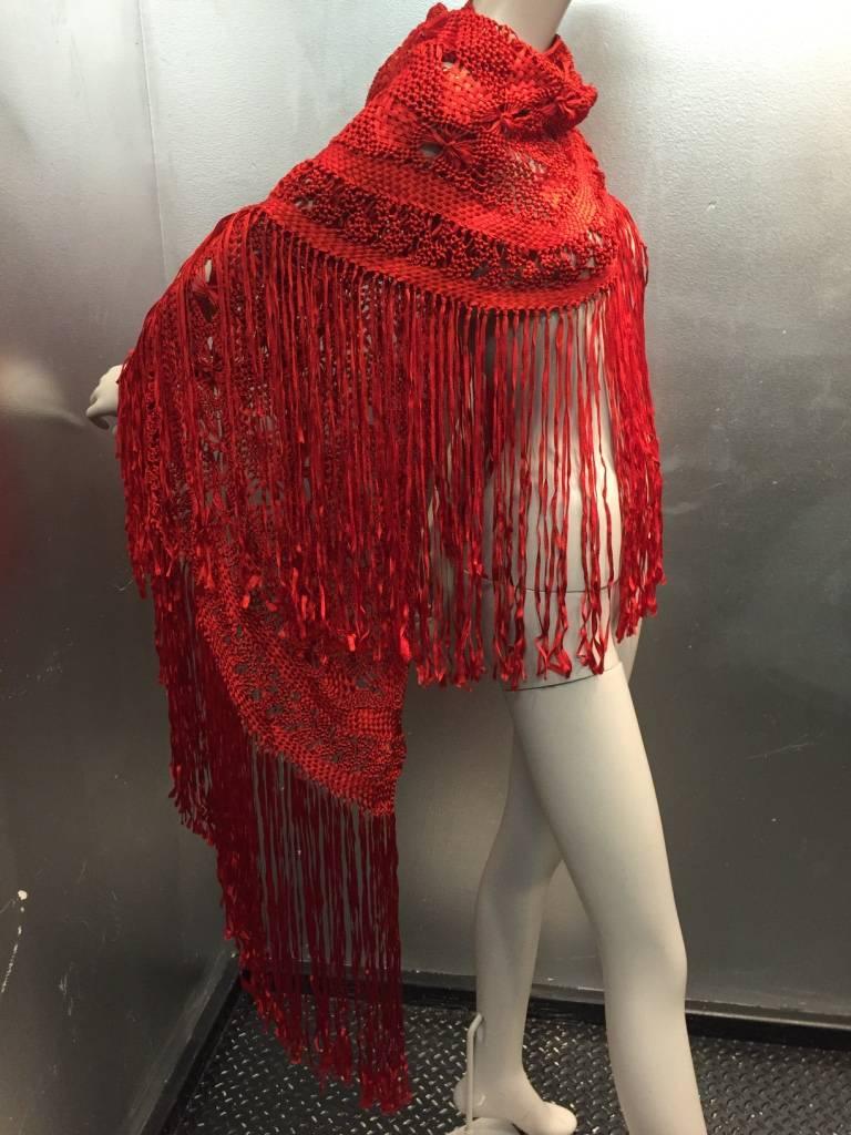 1970s Cherry red rayon ribbon in a macramé fringed shawl.  One size.