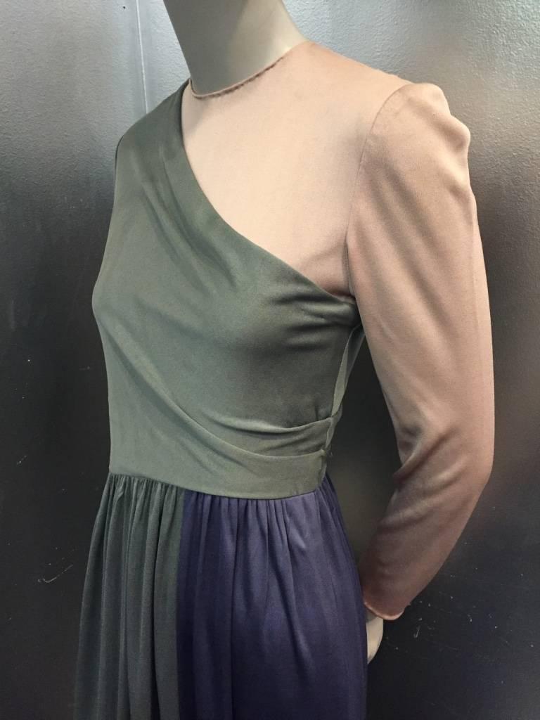 1970s Bill Blass three tone silk jersey draped gown:  Gray silk jersey, mauve silk jersey and indigo silk jersey are draped together in this beautiful and classic Bill Blass style.  Side zipper, back keyhole neck closure with faux covered buttons
