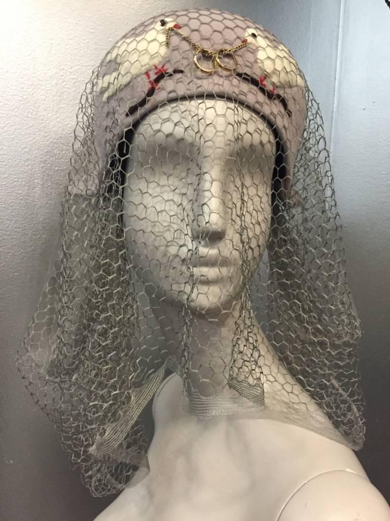 1940s Rare and unusual Irina Roublon couture hat with twin dove appliqués, gray silk veiling and intertwined 14K gold wedding bands. Three original matching hat pins included. 