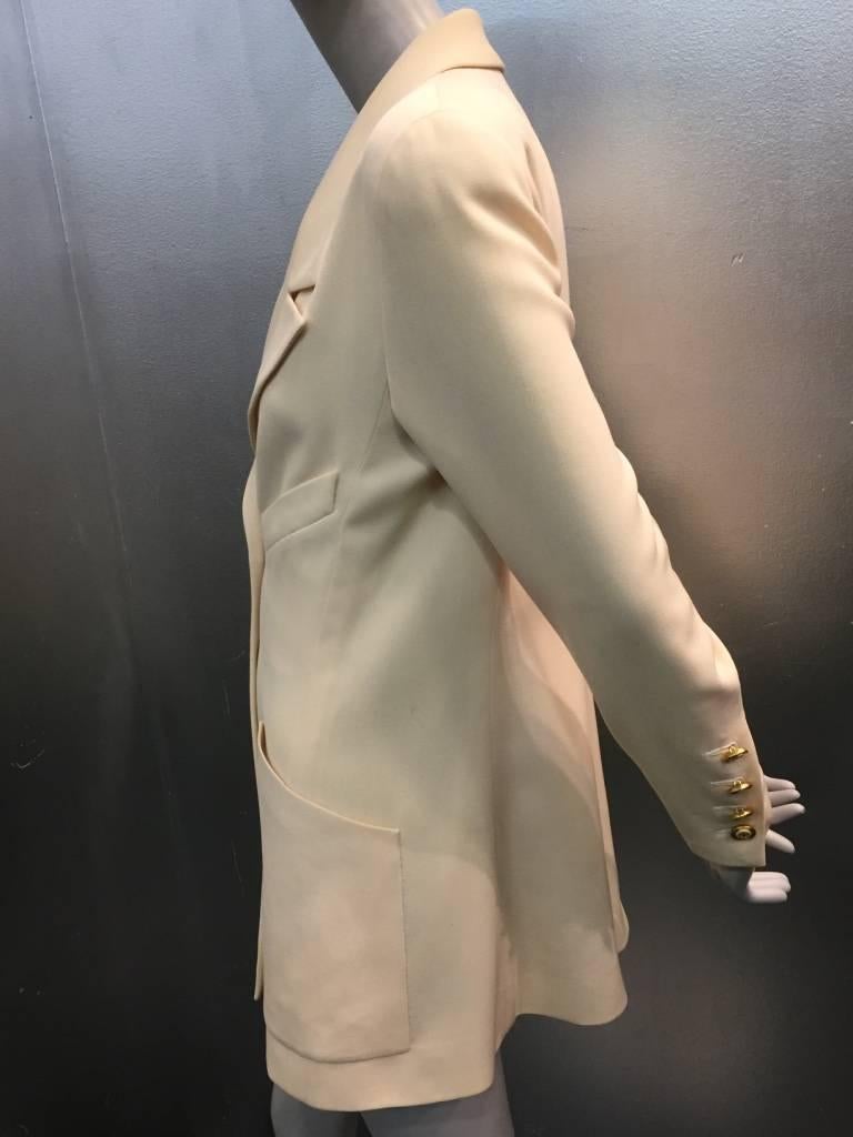 1990s Chanel lightweight cream wool gabardine double-breasted dinner jacket with wide notched lapels, angled breast pocket and patch pockets.  