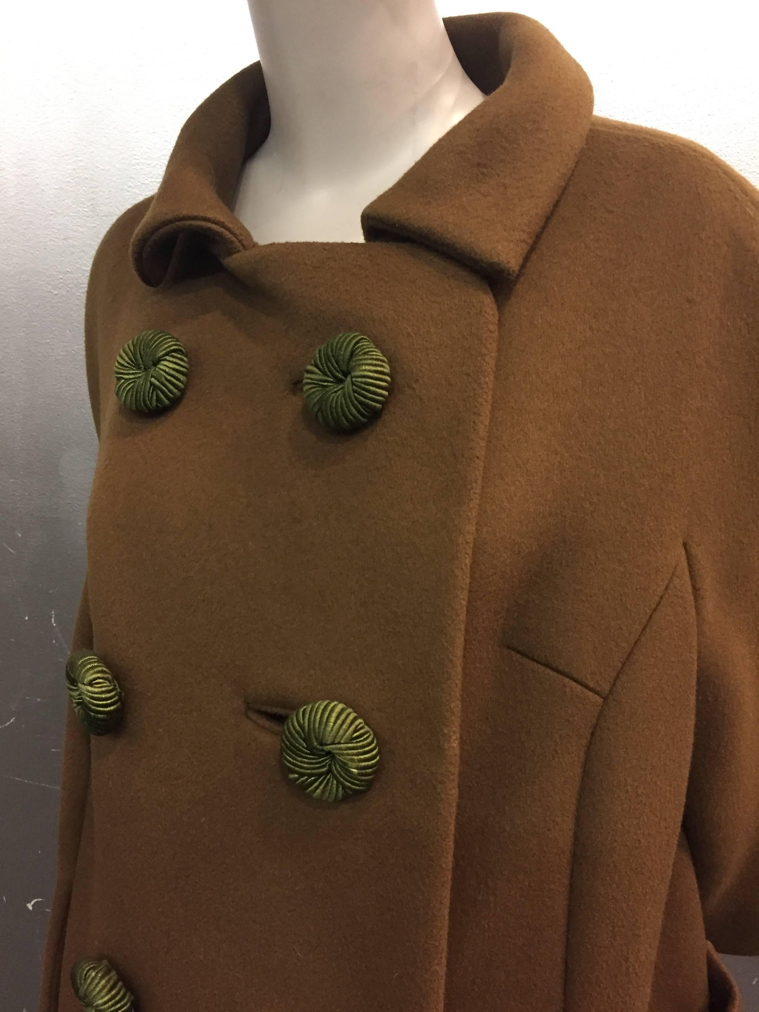 A highly stylized double-breasted  heavy weight wool coat with streamline seaming, 3/4 length sleeve and pouch pockets.

Beautiful coordinating braided buttons and fully lined.

This coat will keep you warm and toasty! 