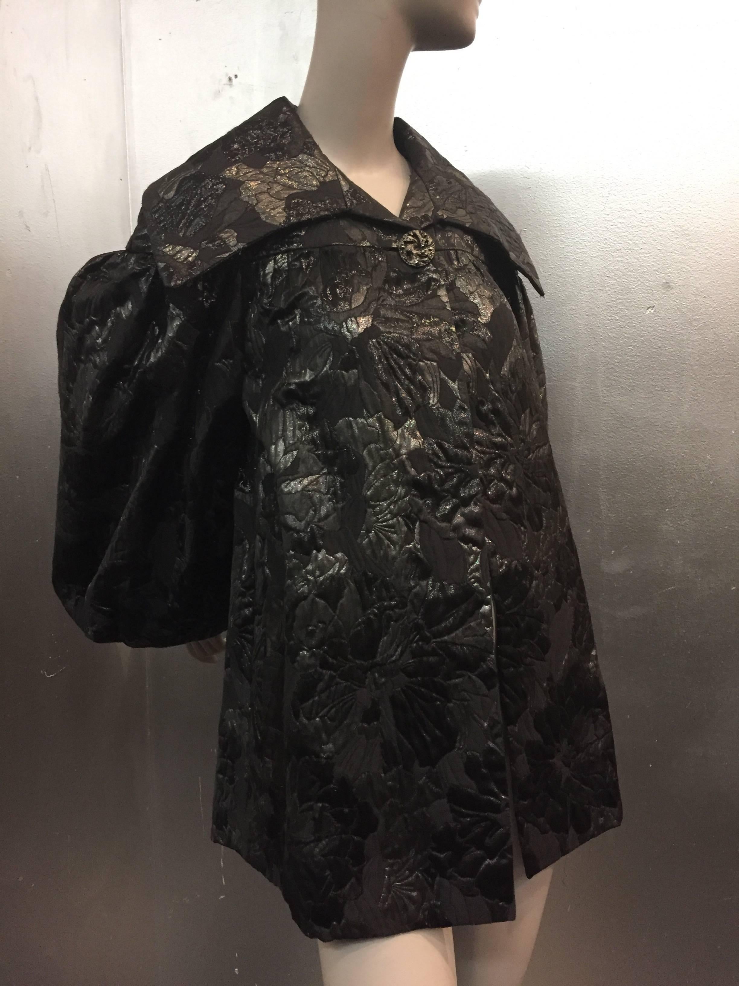 1980s Paul-Louis Orrier 1950s-inspired black and gunmetal brocade swing coat with balloon sleeves.  Large single antique glass button at wide picture collar.