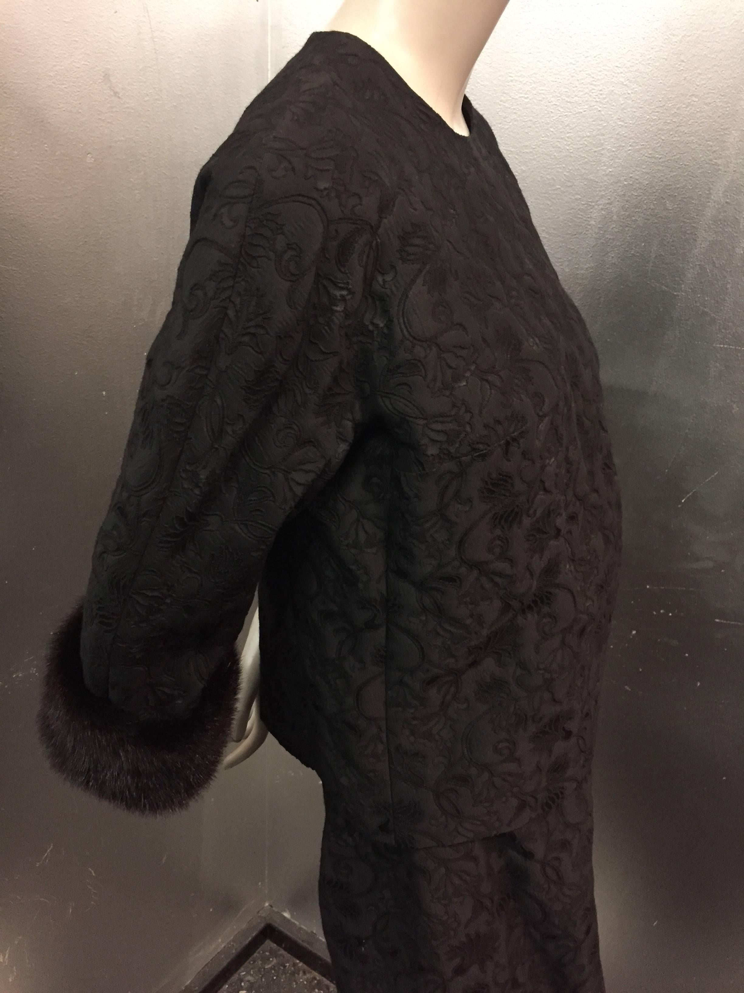 1960s Saks Fifth Avenue black silk brocade 2-piece evening column:  Long narrow skirt with gathered waist. Top is a boxy-fit jacket that buttons down the back with fur cuffs. Gorgeous.