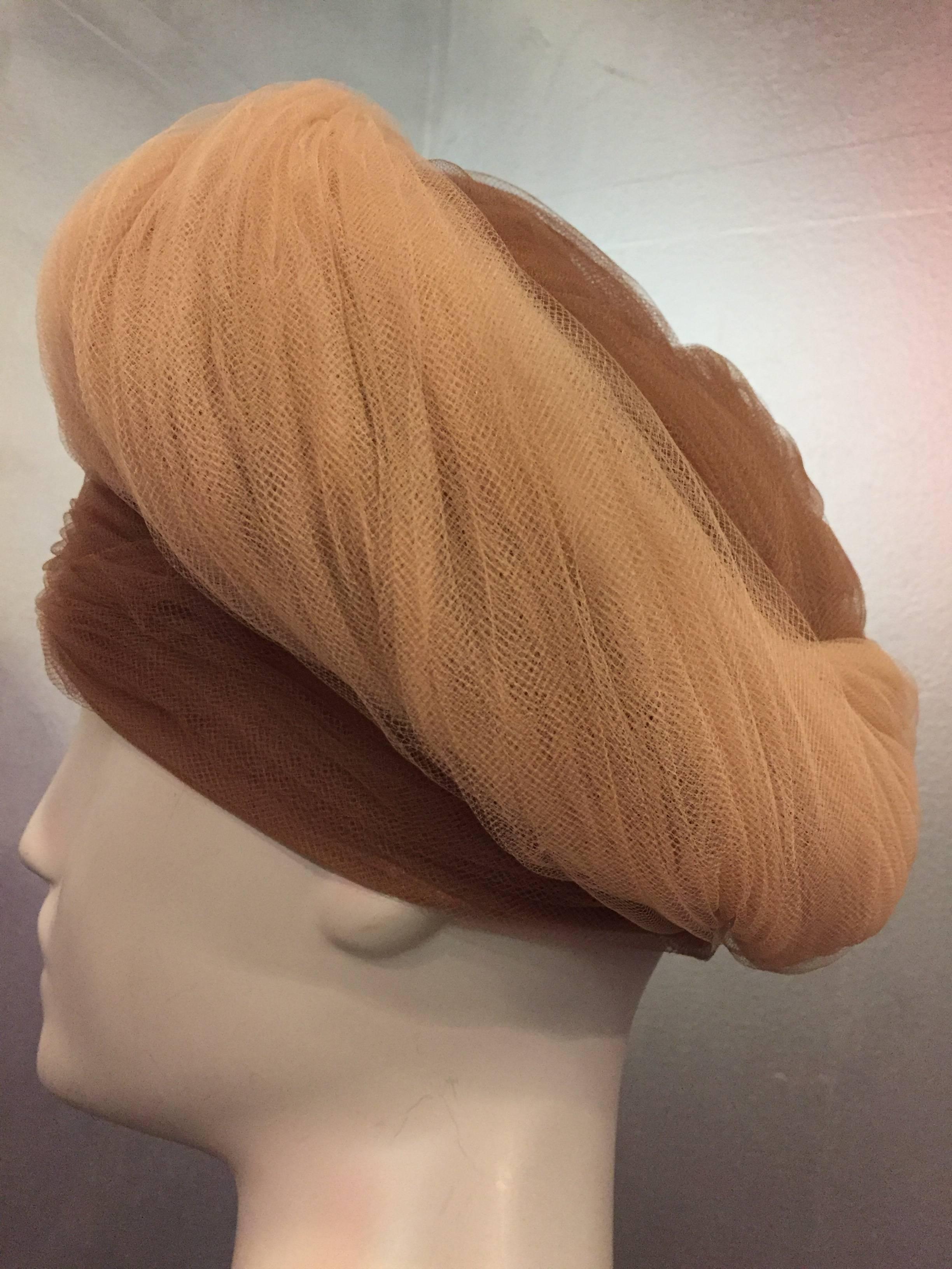 1960s D. Charles beige and camel two-tone soft silky tulle wrapped and gathered in a turban style structured horsehair hat. 