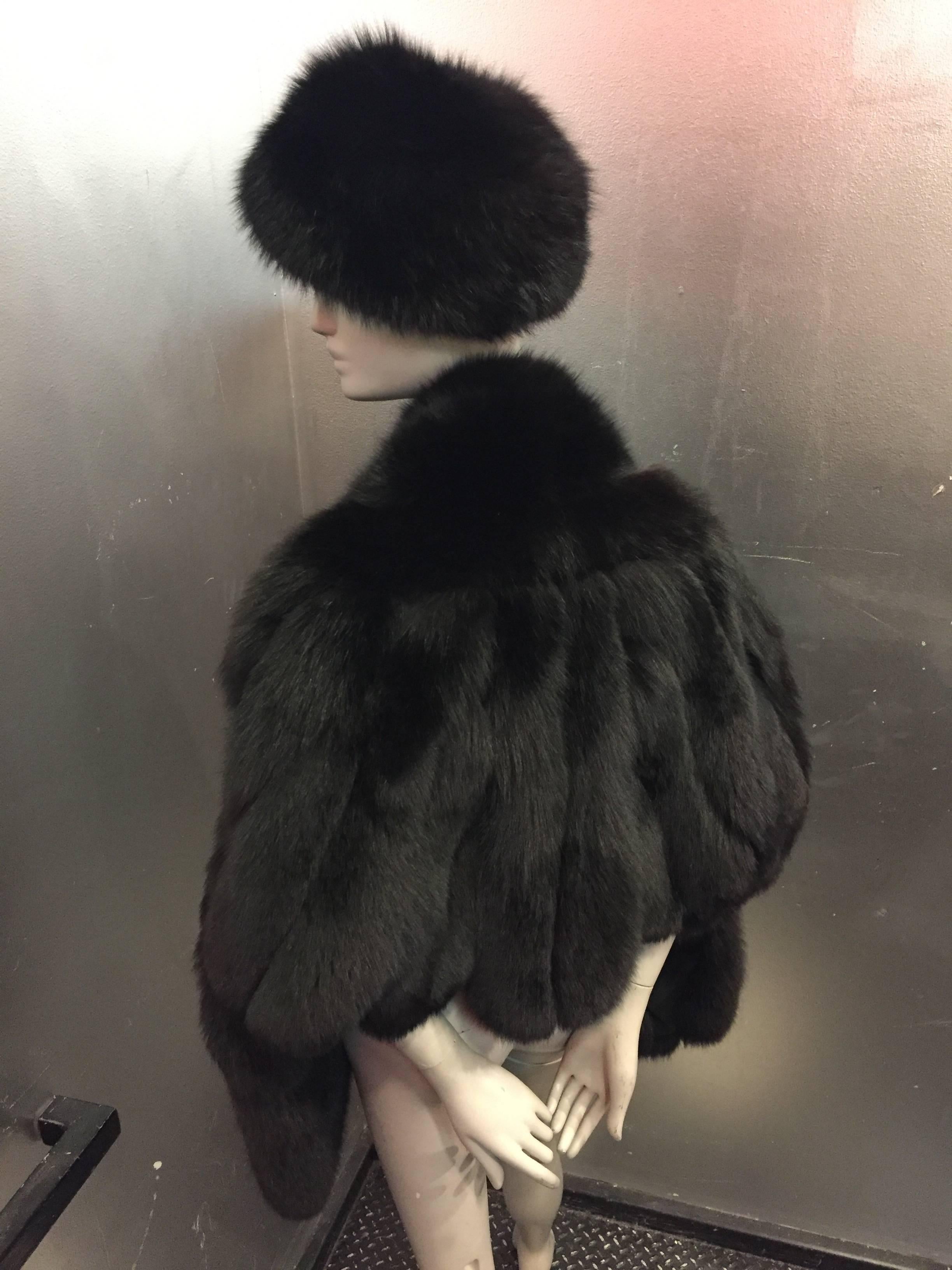 A luxurious 2-piece lot:  A plush and lush 1960s black, scalloped-hem, fox fur stole with a coordinating black fox fur Halston hat. Fantastic combination! 