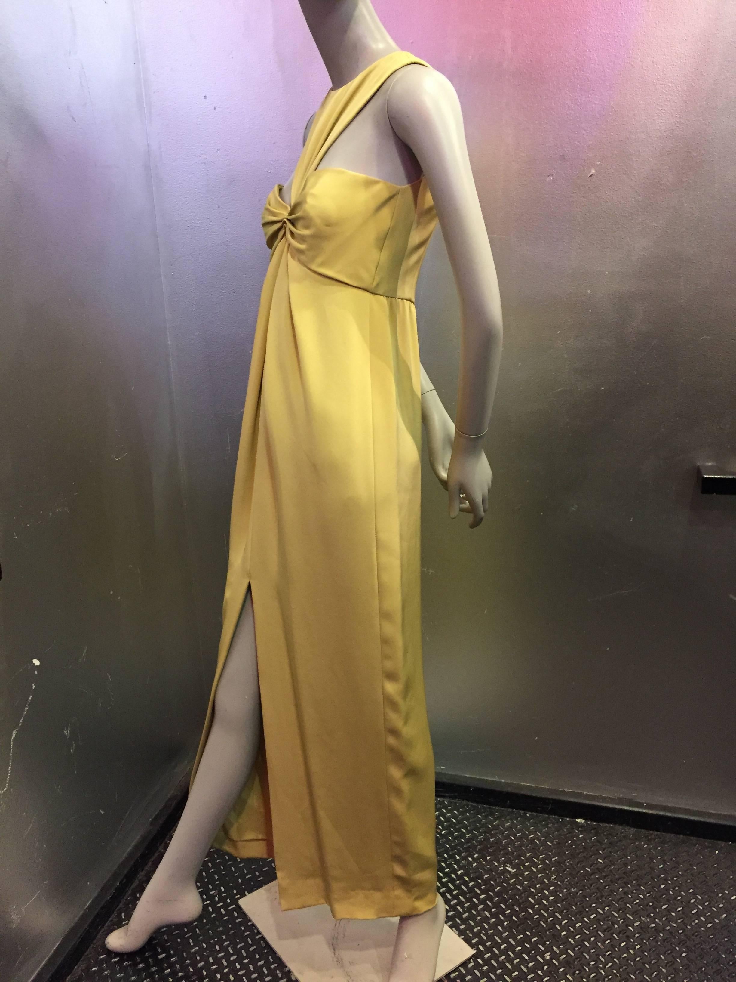 1970s Bill Blass racer-cut matte gold silk evening gown with gathered bust and high center slit.  Fully lined. Zippered back. 