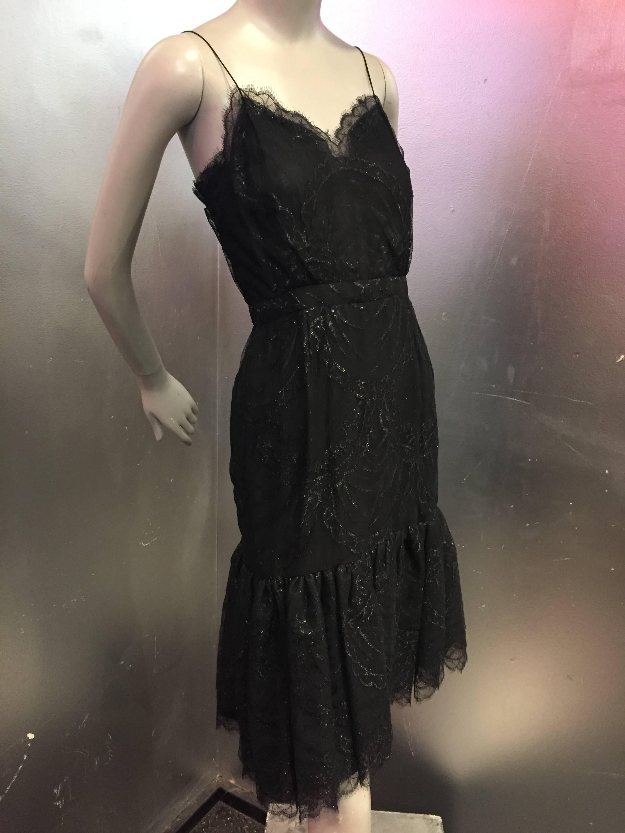 Bill Blass black silk net lace slip-style cocktail dress w gathered net lace flounce hem.  Very sheer and sexy with side zipper and spaghetti straps. 