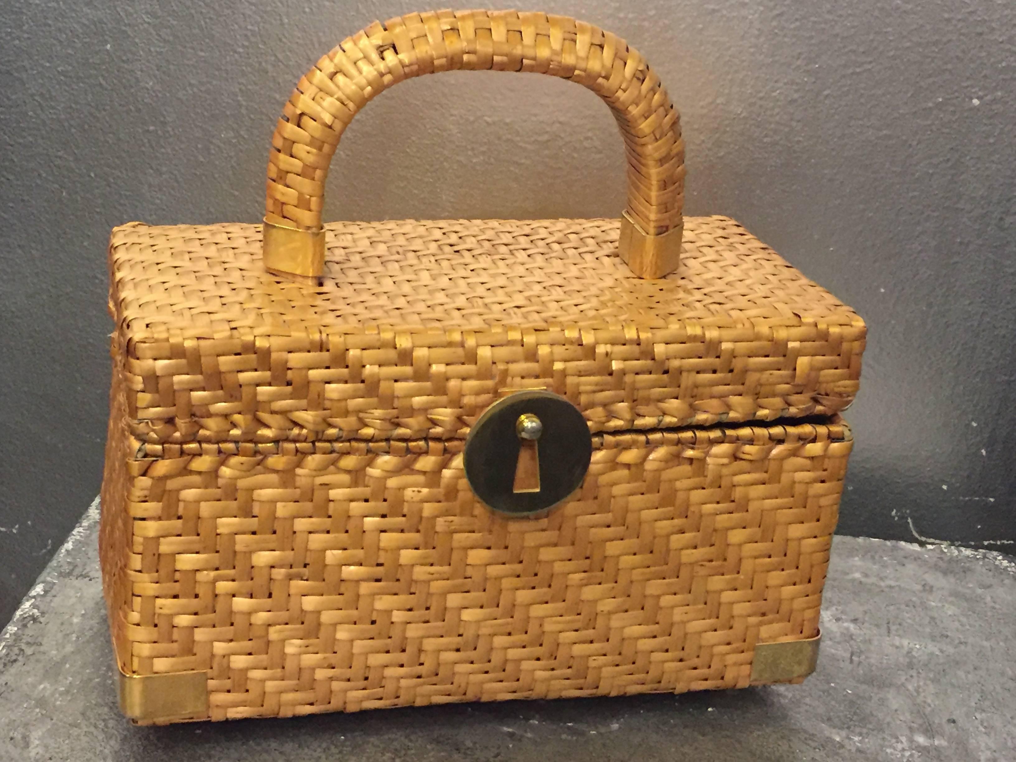 A fun and lady-like resort purse in a box shape, by Koret. Featuring signature hardware in gold tone. Fully lined with coordinating fabric. 