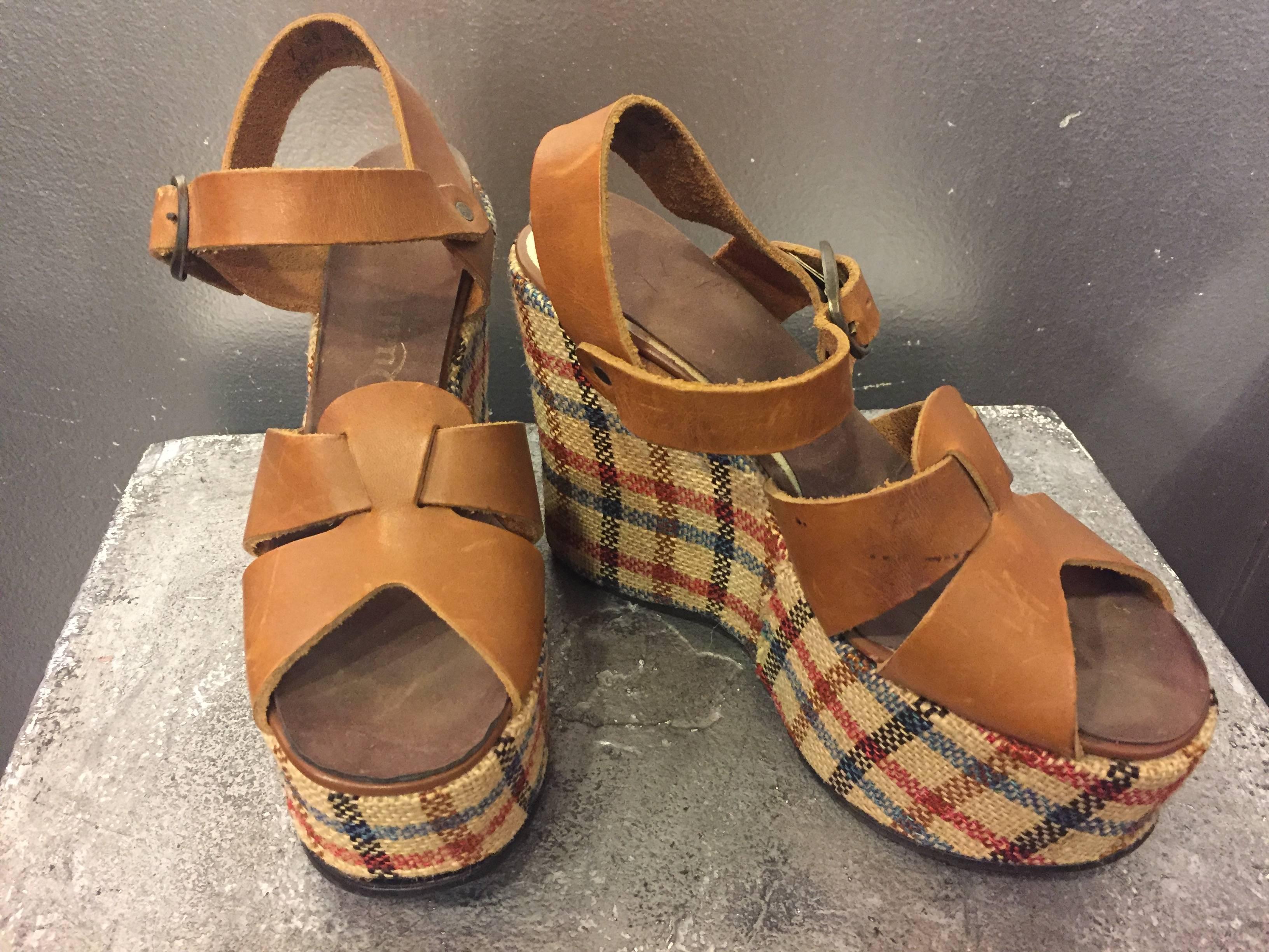 A funky pair of Quality Craft plaid wedge platforms. Saddle leather, woven front and ankle strap. 

Fits about a modern size 6.5 -7 medium. 