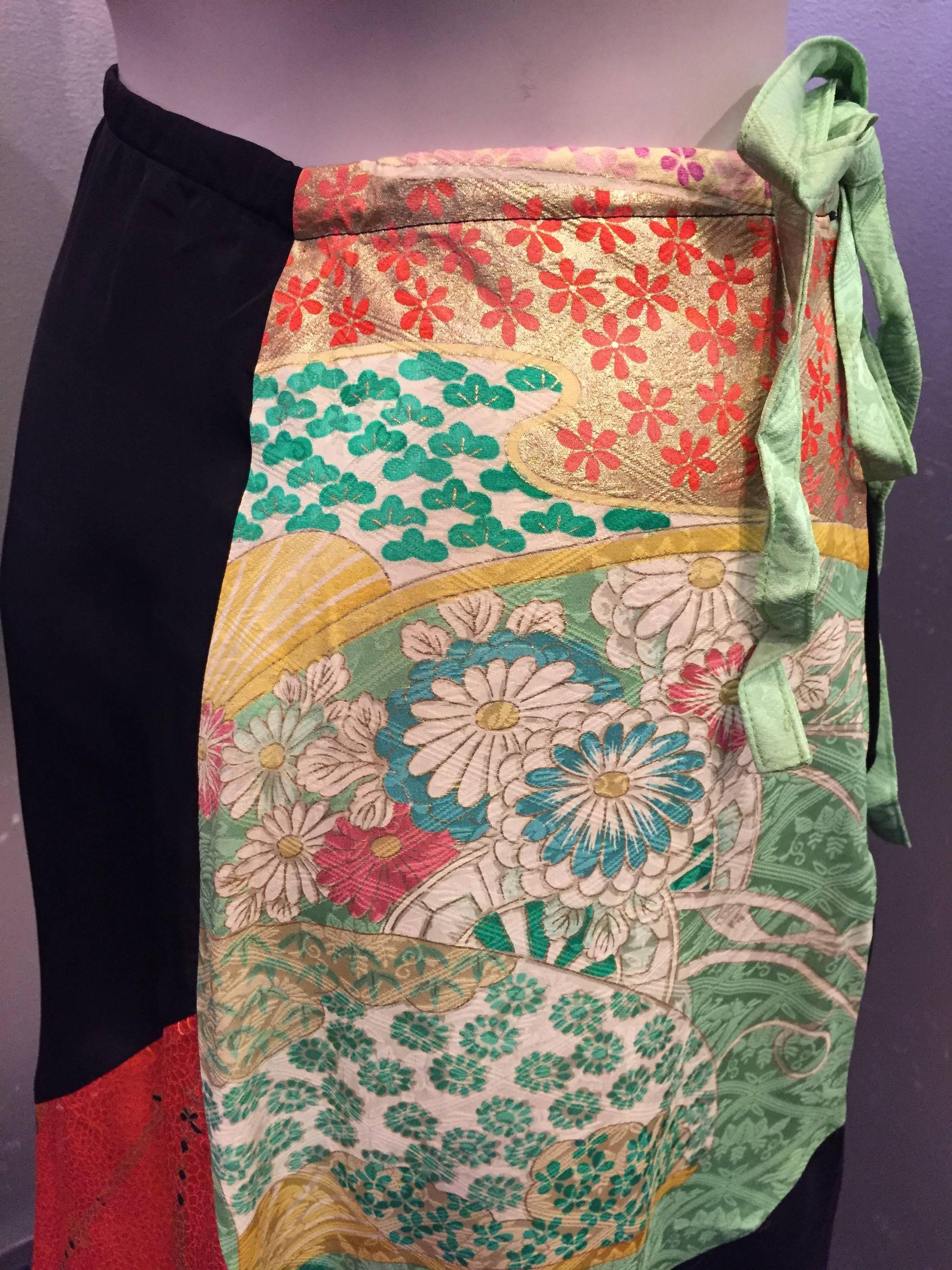 This lovely skirt features a beautiful color combination of vintage silk Kimono pieces that date to the 20's and 30's. It is cut on the bias and high-waisted in a manner reminiscent of a half slip. The kimono fabric has some natural structure,