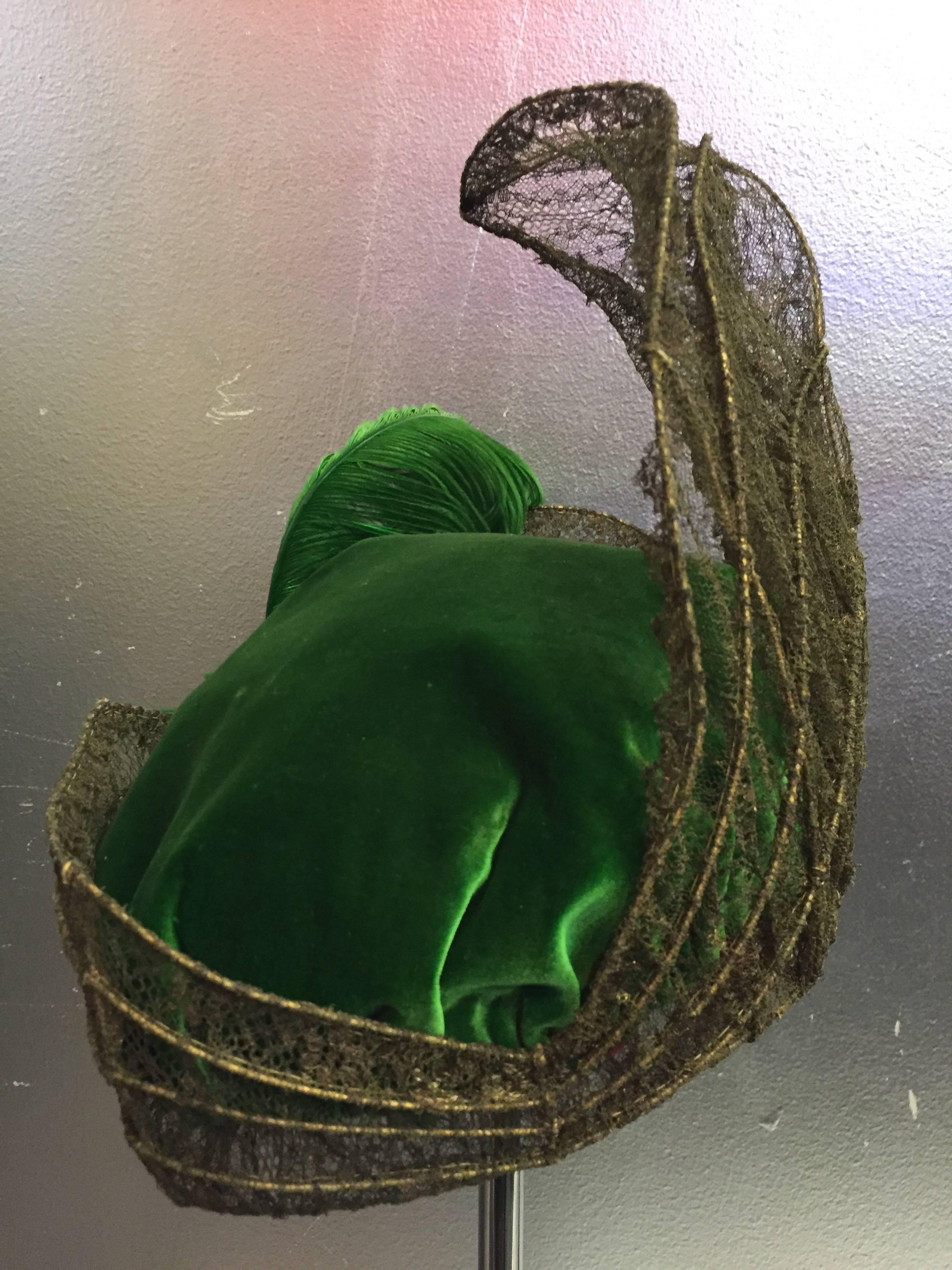 This is an ultra-rare couture constructed Edwardian hat fit for a period film. The parrot green silk velvet and finely wired gold lame lace are reminiscent of a ship sail. Soft gathered crown and lined in golden silk with a label marked The