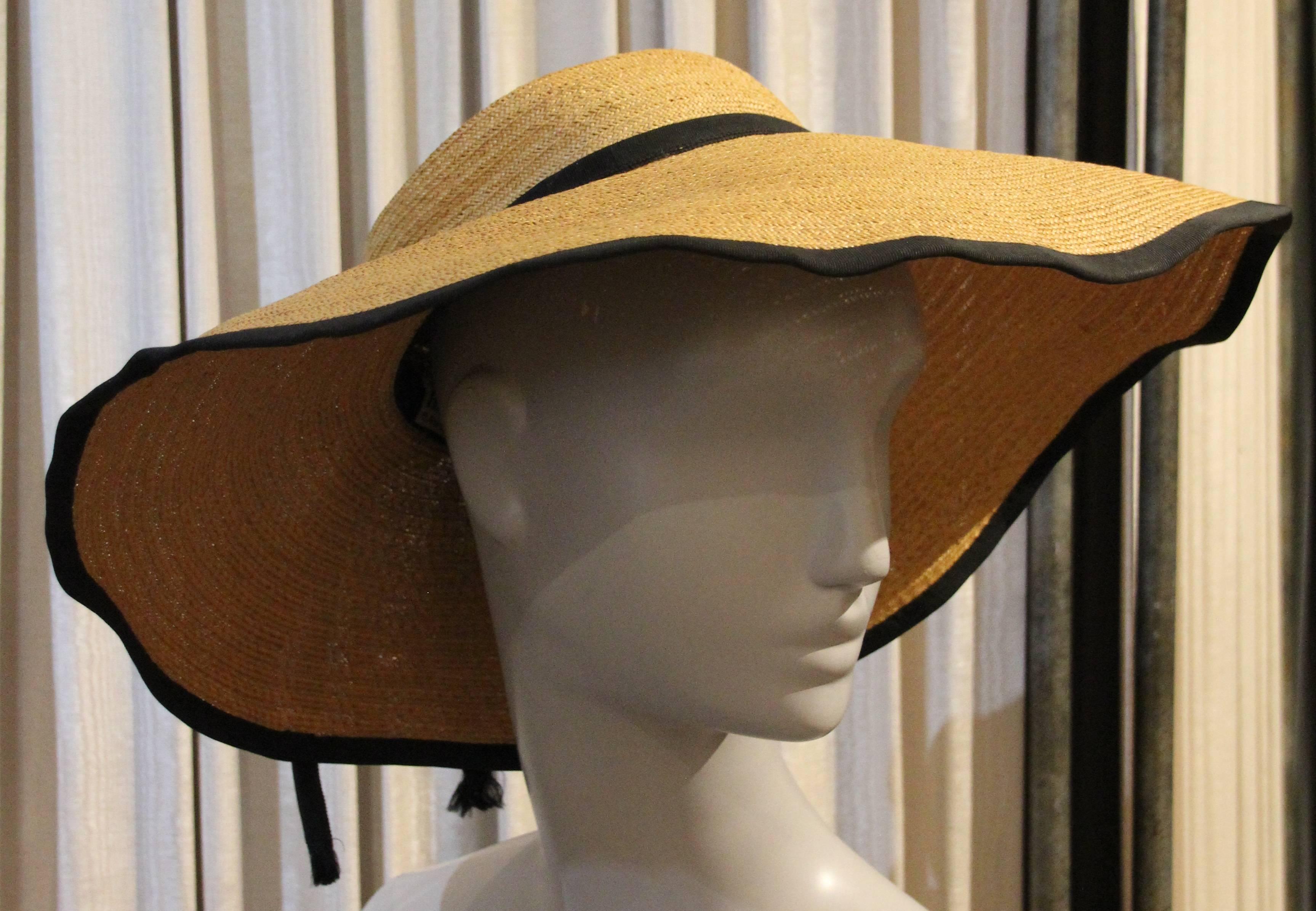 A beautiful and fresh 1950s Helene Dietsch Couture wide brim, finely woven straw hat with black grosgrain trim, band and bow.  A low pinch pleated crown.
