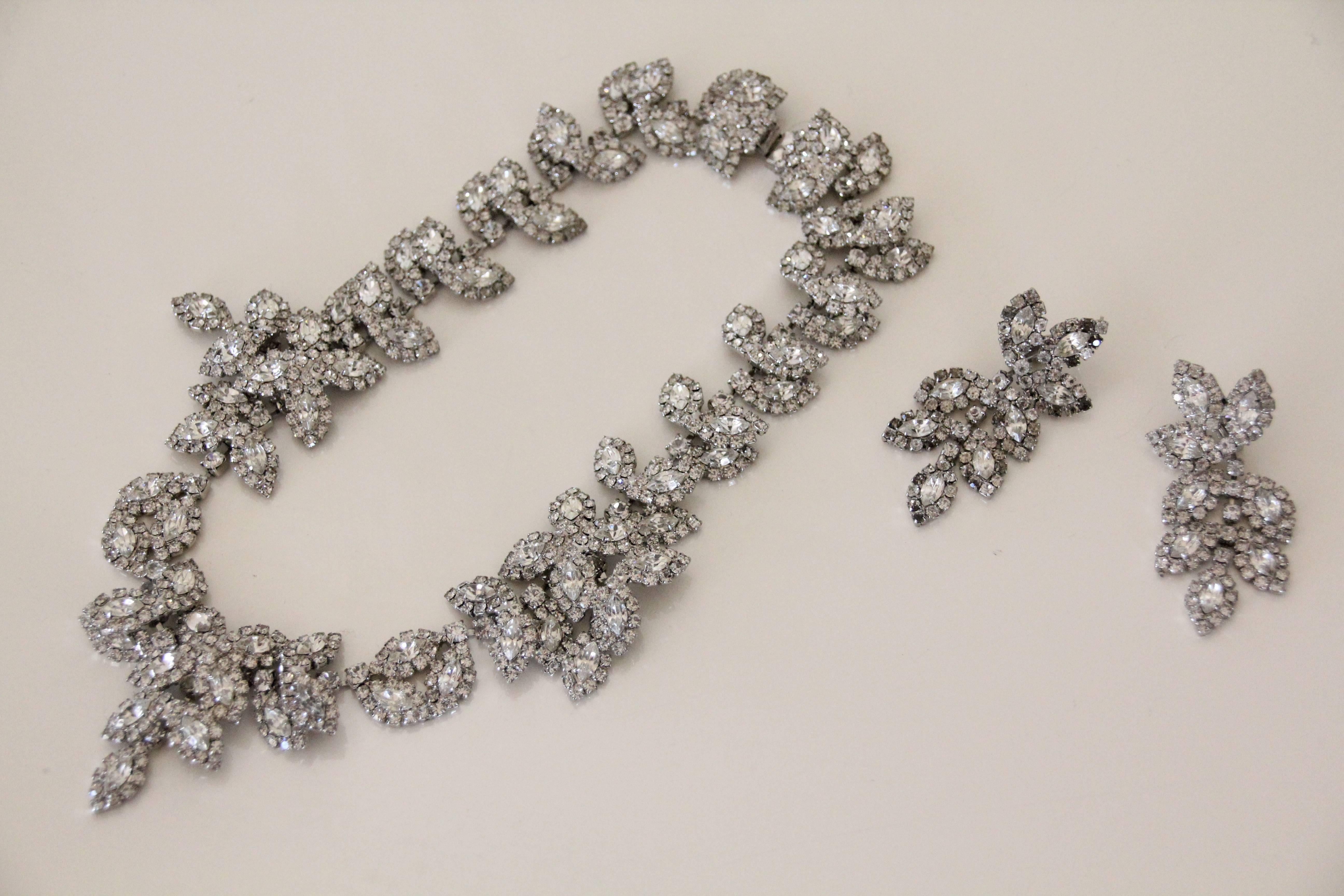 A classic 1980s foliate clear rhinestone necklace and clip earring set!  with 3 larger lobes of foliage at center and sides.  This set gives a gorgeous shine and is nicely articulated, not stiff. It is a collar length necklace and the earrings are