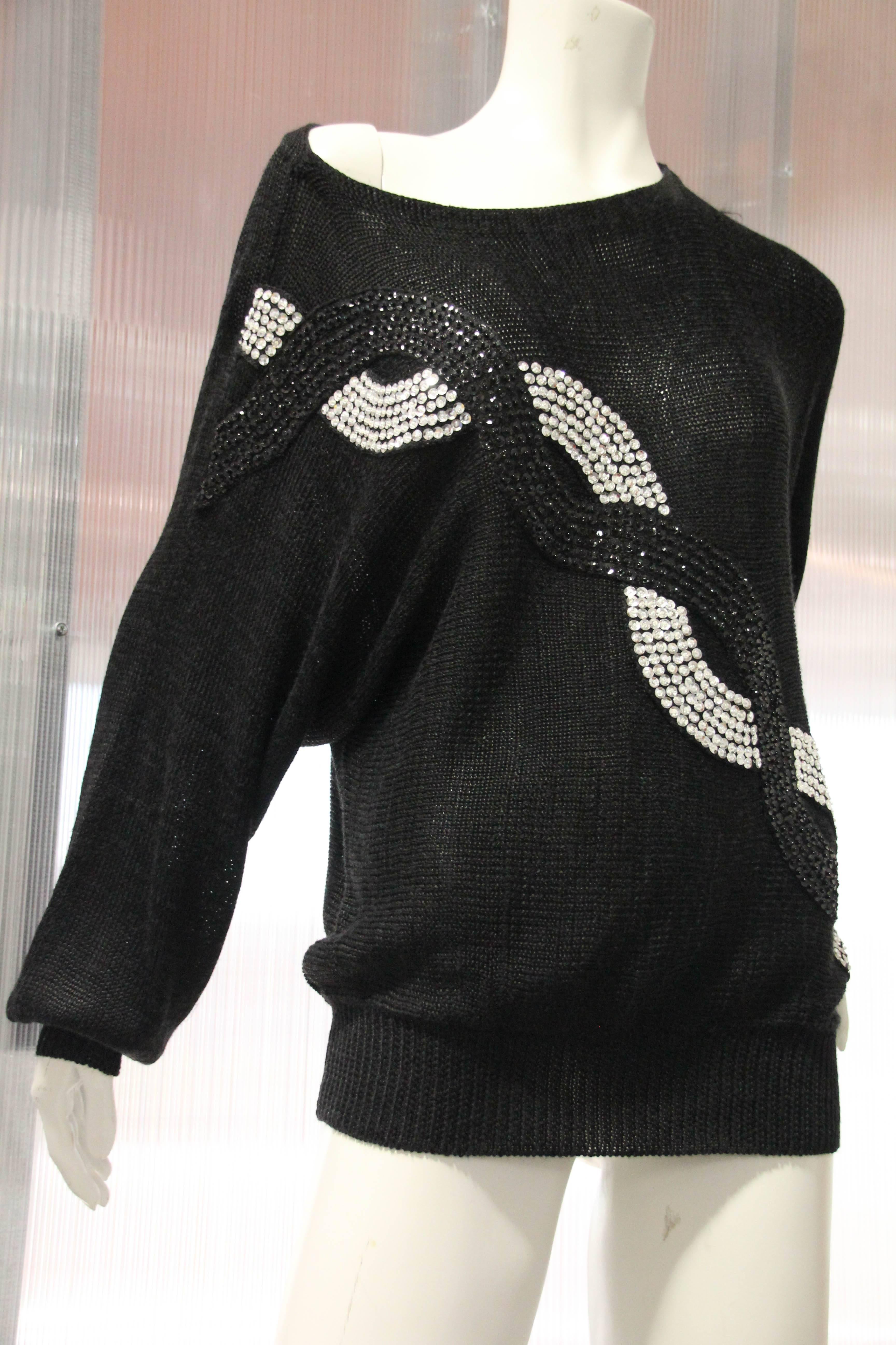 1980s Italian knit rayon cocktail sweater with black and silver bead and sequin embellishment: two serpentine lines of sequins in black and white intertwine for a chain link effect. 