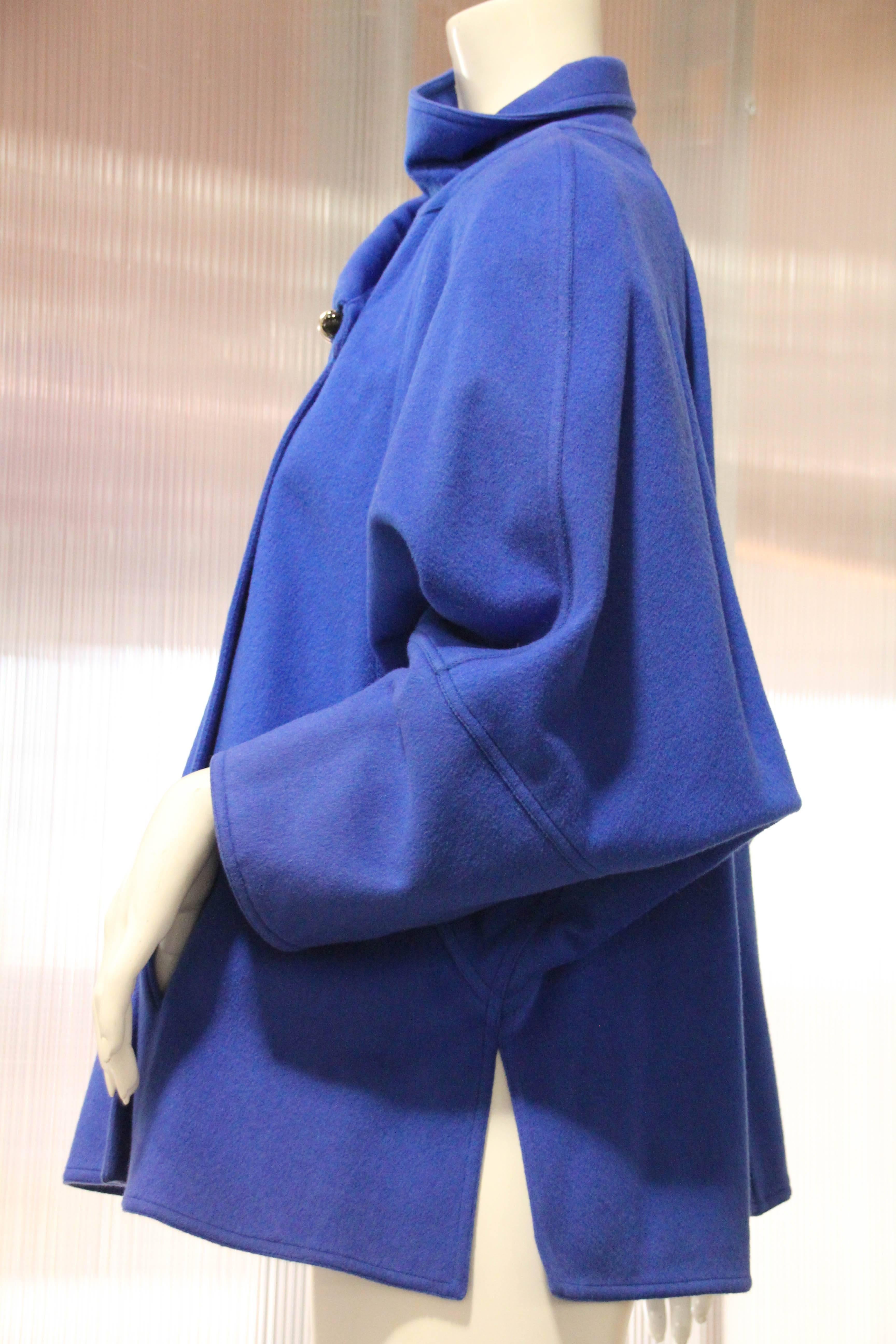 1980s Chloe electric blue wool felt swing coat with Chinese-inspired silhouette: asymmetrical collar treatment and one toggle button. Fully lined.  Full raglan sleeve. Smock style fit.