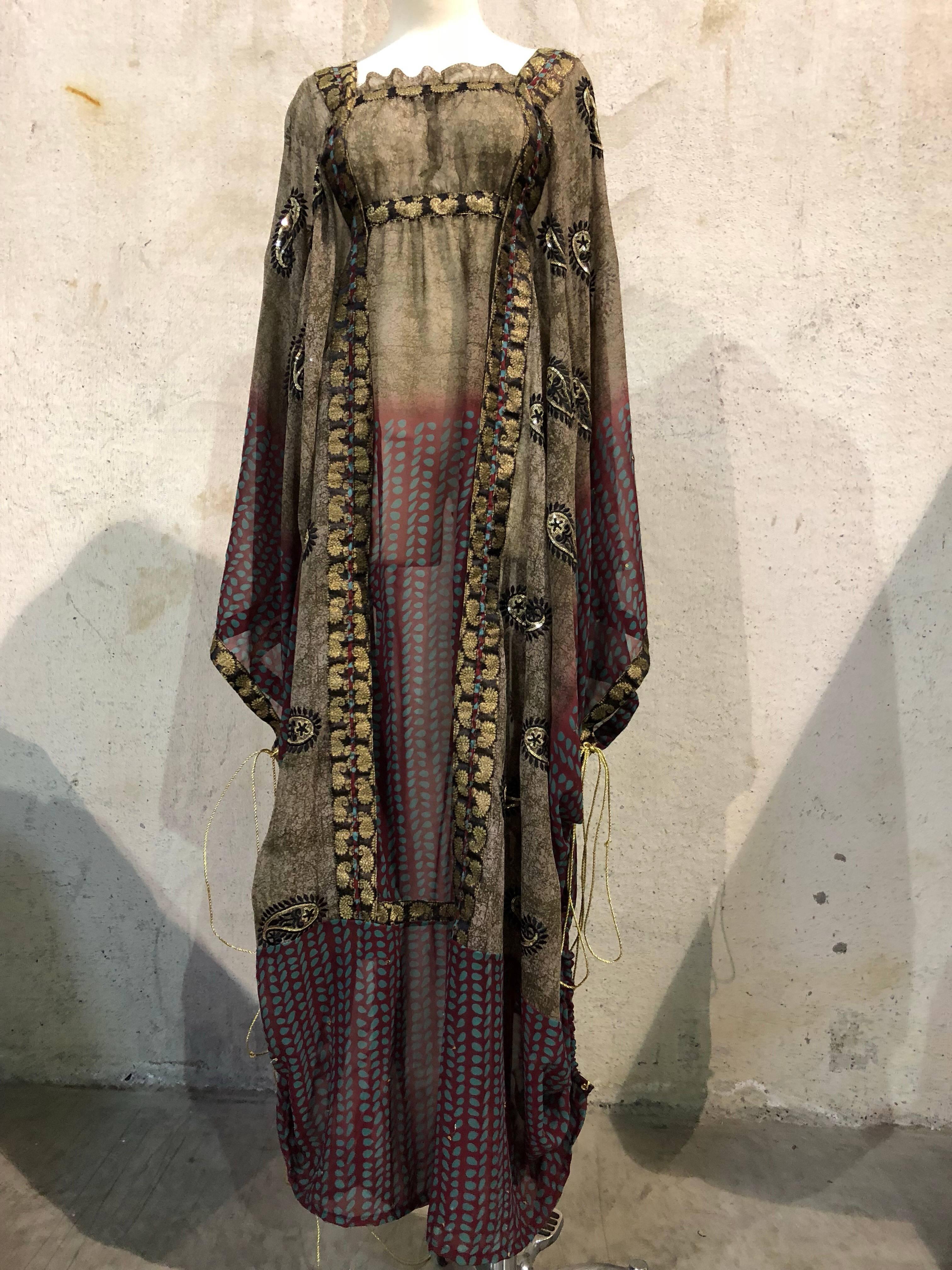 Custom-made Thea Porter-inspired Kaftan: Constructed of vintage beaded silk sari fabrics in gold, black and taupe.  Paisley designs. Empire waist with inner tie. 