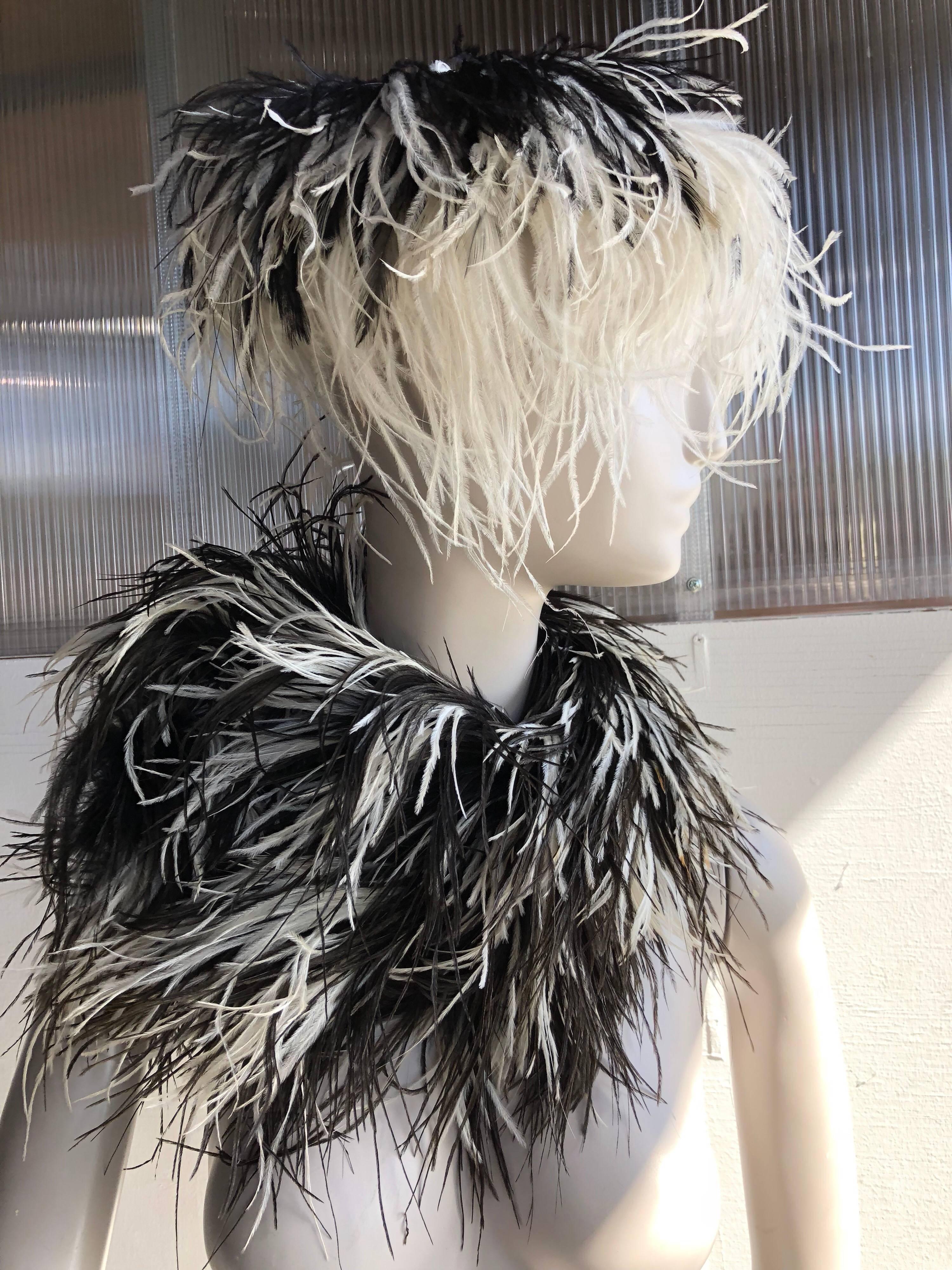 1950s Rare William J. black and white ostrich feather saucer-style hat, with center, top button embellishment.  Sold with a beautiful black and white feather boa that matches, but was not originally a set. William J. is better-known as famed