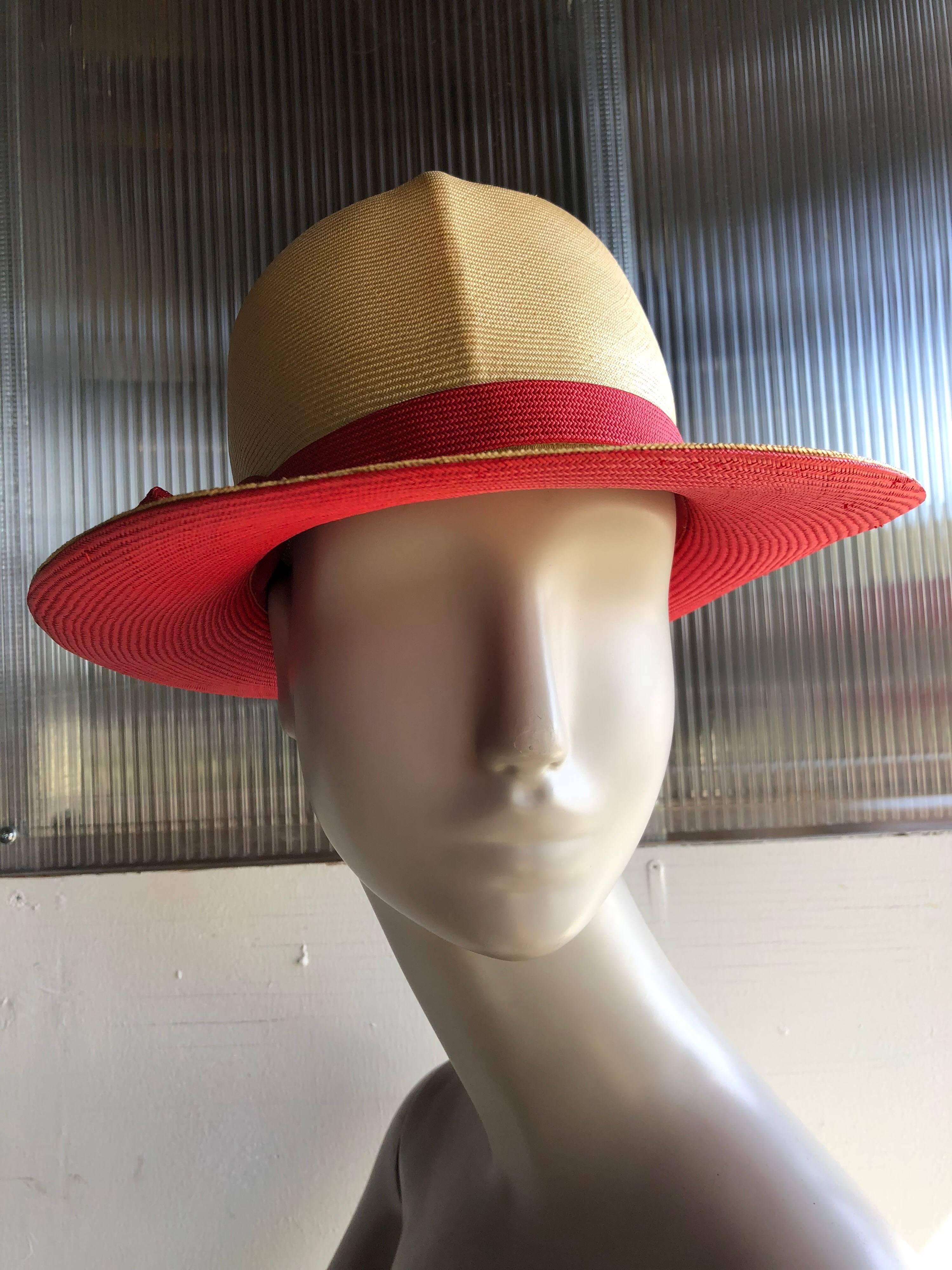 A smart 1970s Adolfo for I. Magnin two-tone straw hat:  In natural straw with red straw under the brim and on bowed band. Tall crown has pinched front crease.  Smart and tailored!  