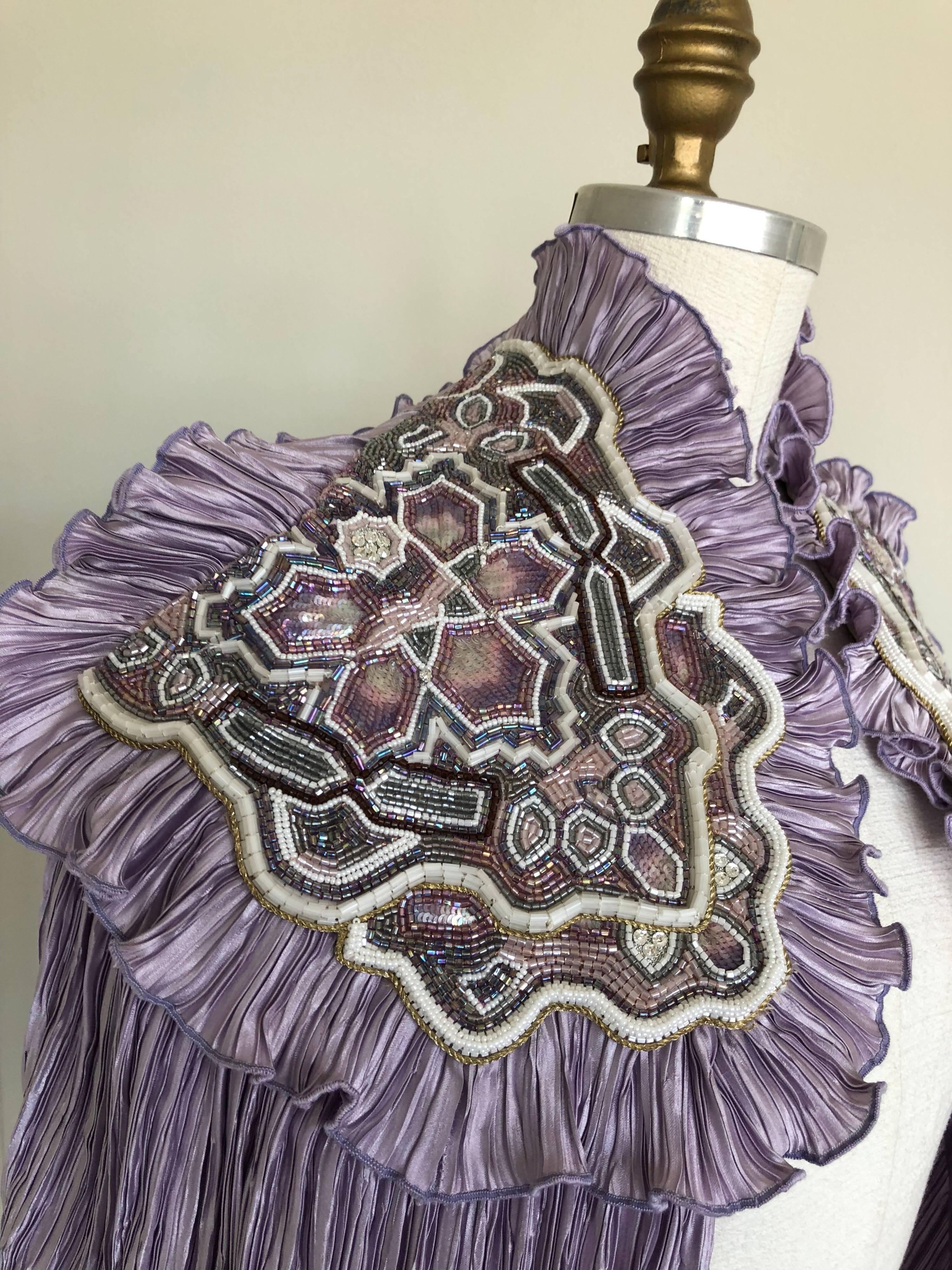 A fabulous custom-made heavily pleated and beaded capelet in lavender silk. Made from 1970s Fortuny-style pleated fabric and embellished with heavily beaded shoulder panels.  Unlined. No closure. 