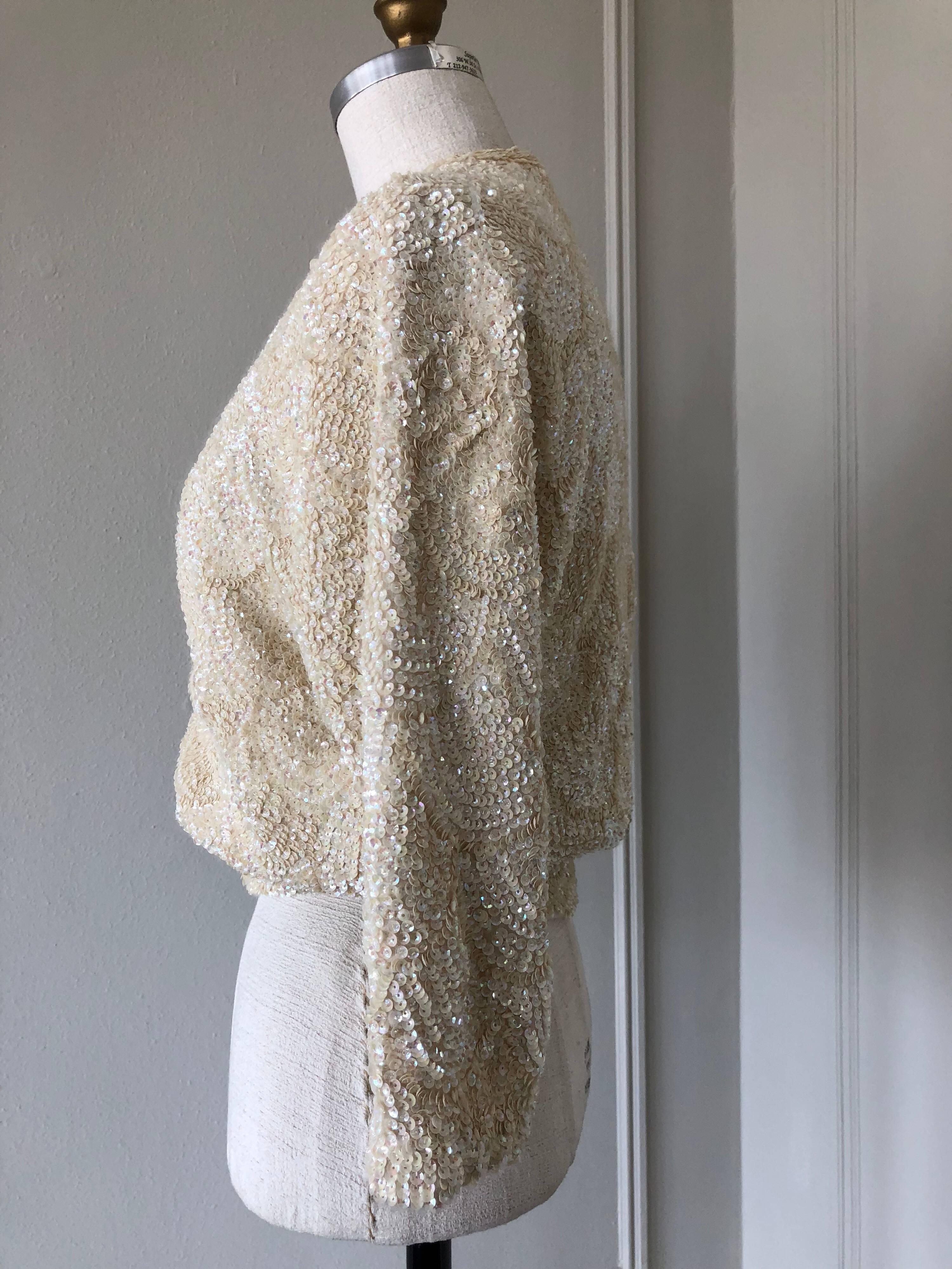 1960s Bonnie Wong hand-beaded cream angora and lambswool cardigan with faux pearl buttons down front.  Silk chiffon lined. 