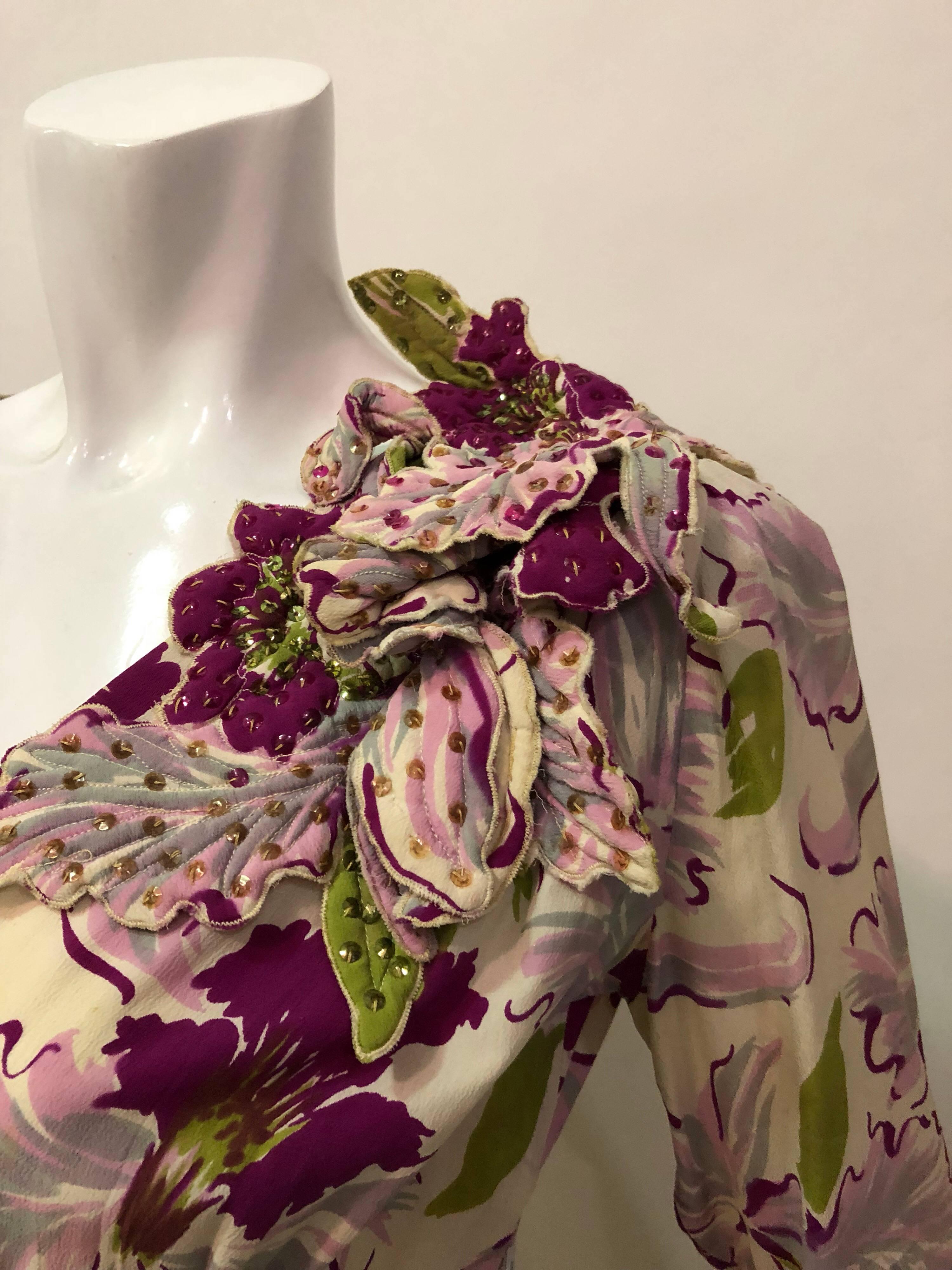 1940s Orchid print rayon crepe dress:  Large-scale orchid print makes this fabulous V-neck dinner dress really pop!  Long sleeves and a sarong-style pleated and gathered panel at side front and a dramatic orchid corsage at left side of neckline made