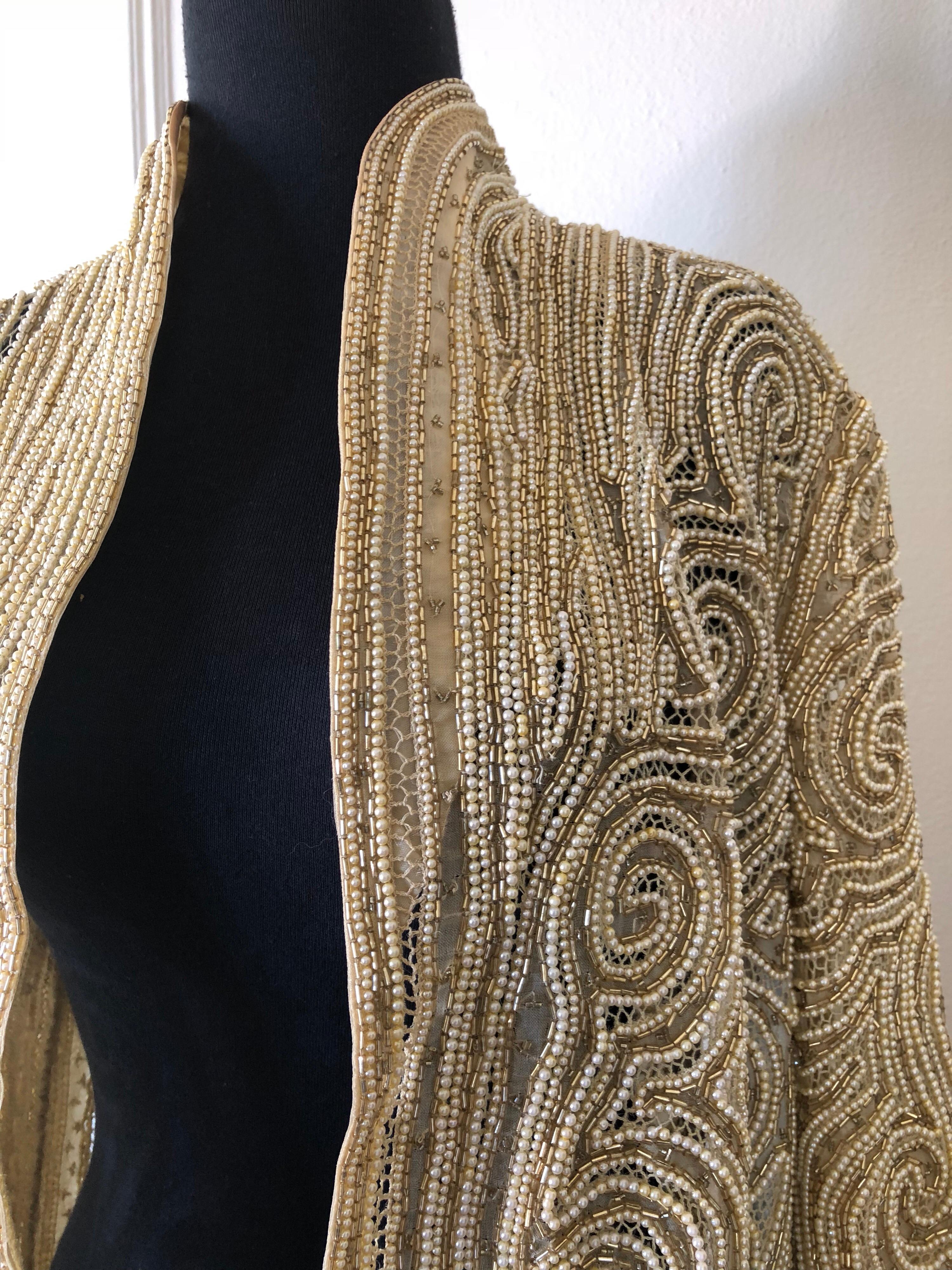 A gorgeous 1980s Halston faux pearl, crochet and gold bugle beaded silk organza lace jacket. Unlined. No closures. Originally sold at Amen Wardy. Size 6-8.