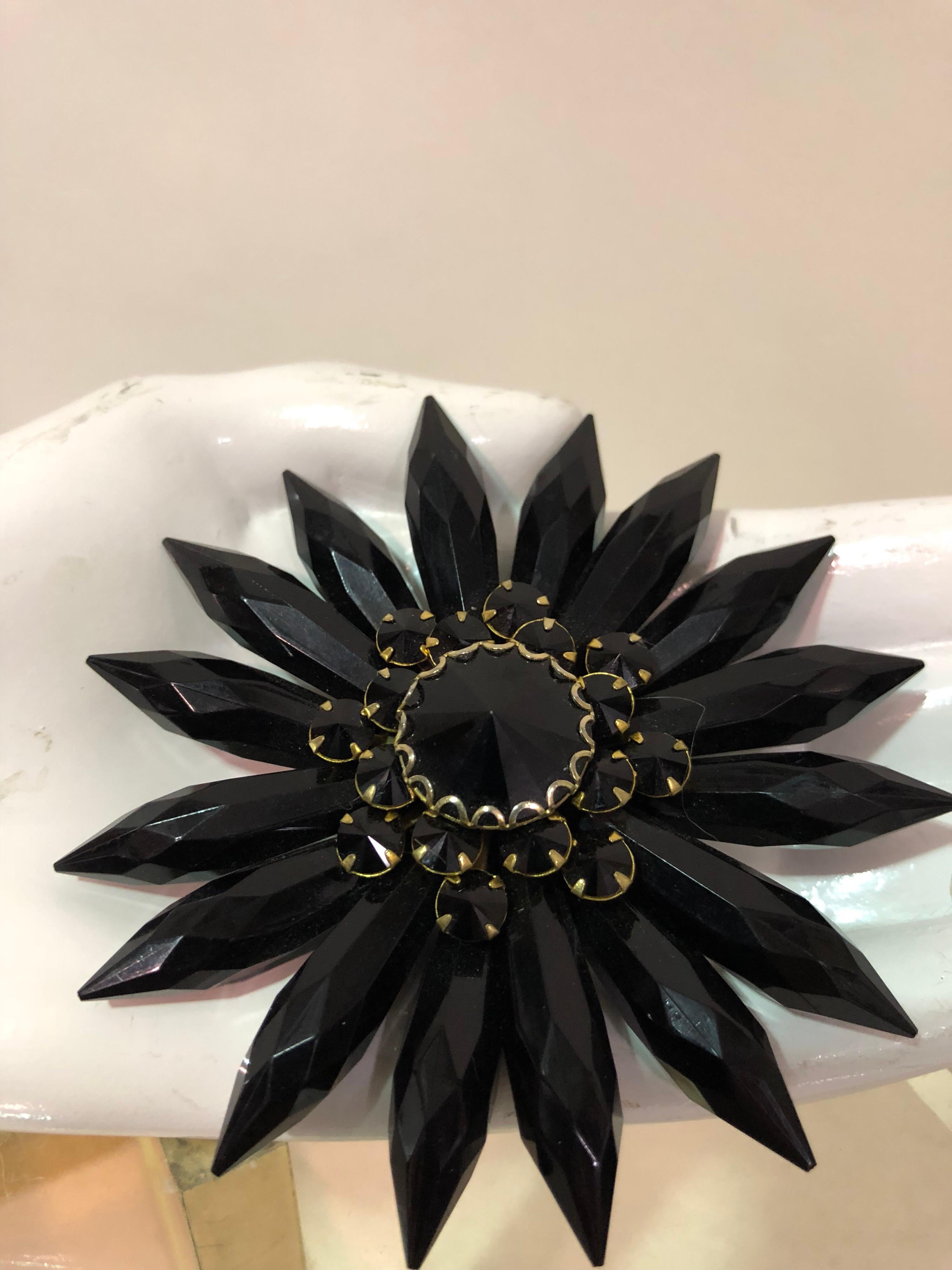 1950s Coordinating large black lucite flower brooch with jet black glass flower earrings in Japaned setting. Clip backs.