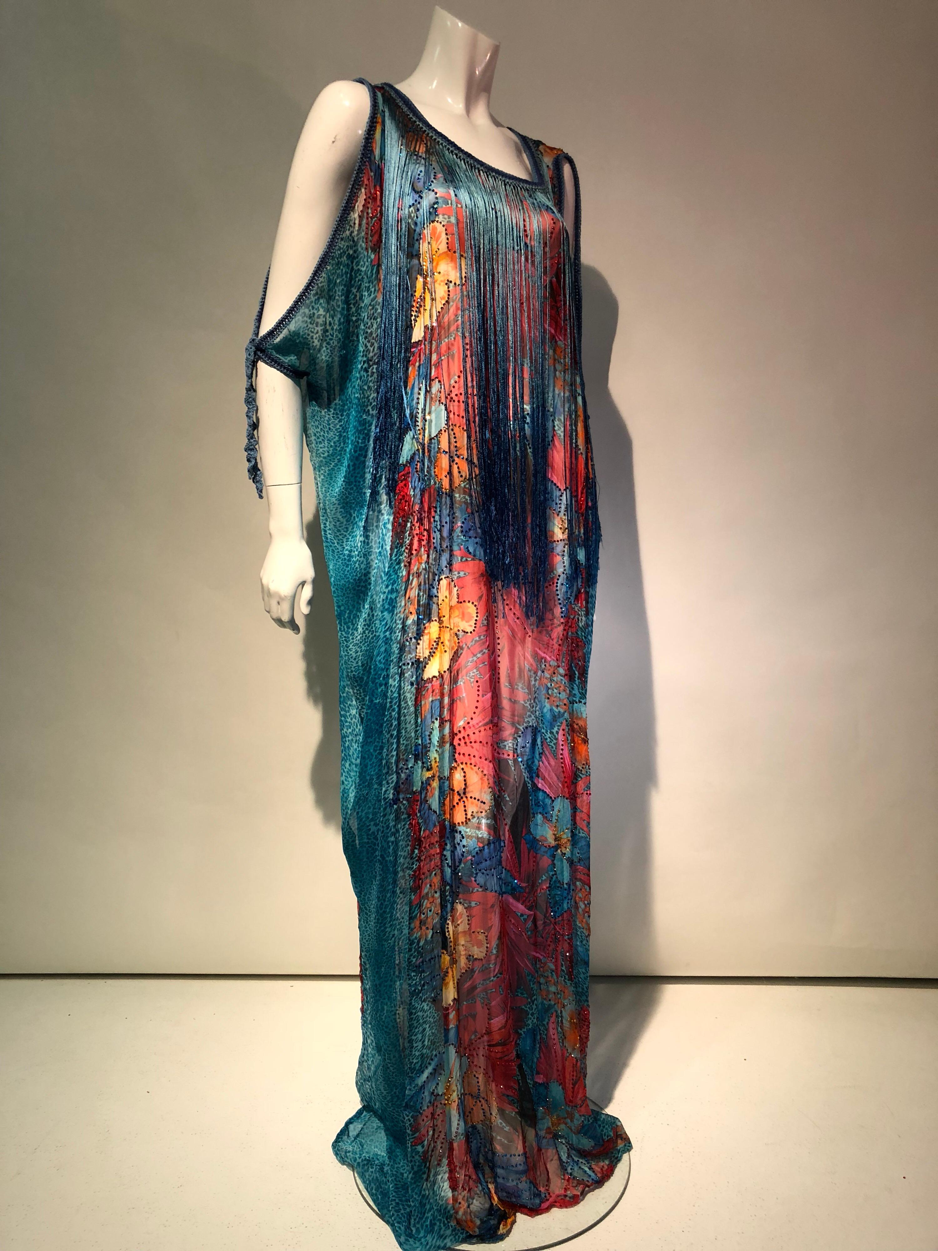 Featured here is a custom made turquoise silk chiffon print fabric Kaftan with an exotic array of colorful florals and orange Tiger Lilies. 
The Kaftan fabric is completely speckled with an array of quartz crystals throughout the floral