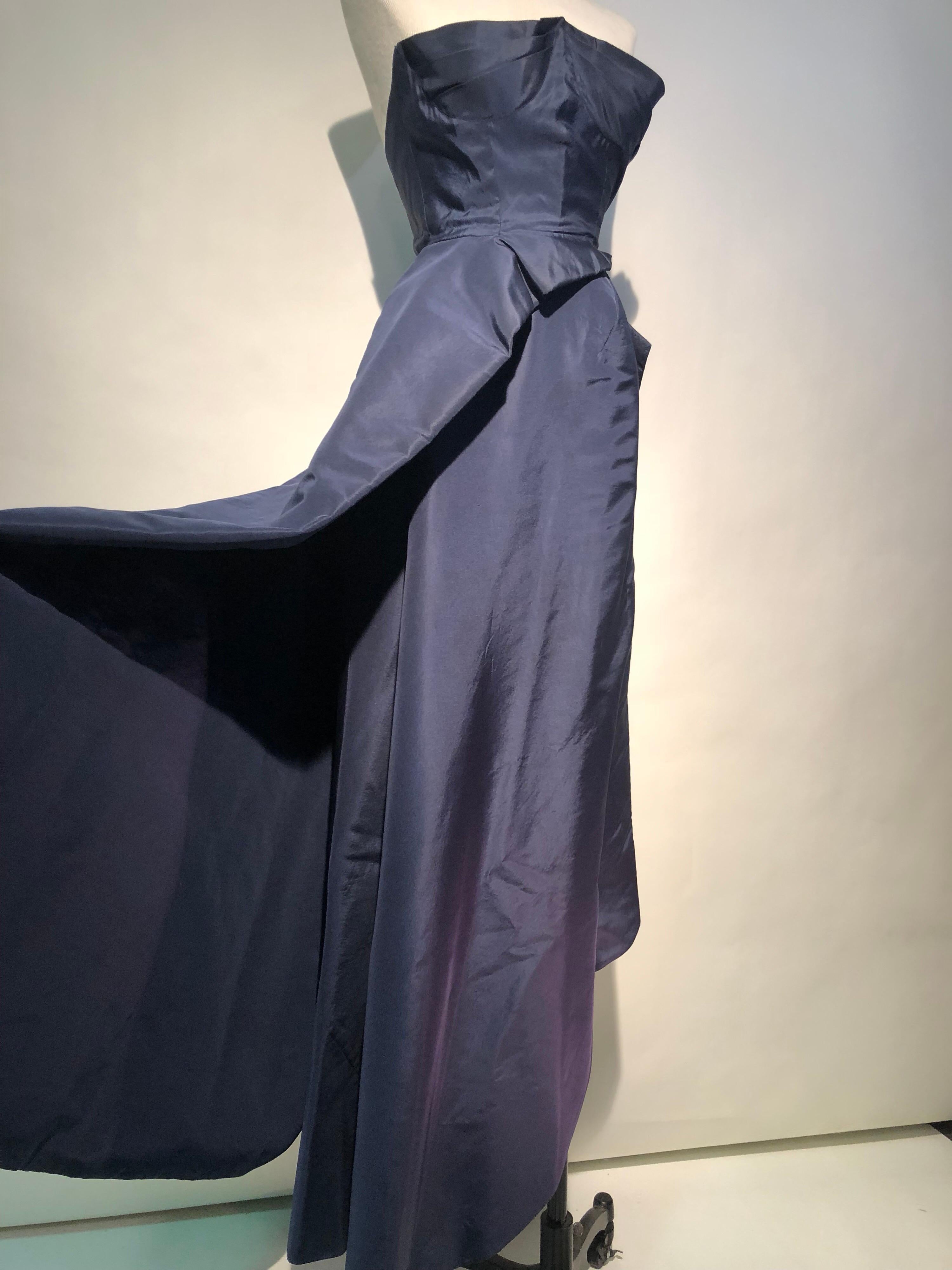 An incredibly rare late 1940s Elsa Schiaparelli Haute Couture navy silk taffeta strapless ball gown: 2-piece Avant Garde construction and classic sophisticated appeal. Long under skirt is a separate piece with the structured bodice and side drape