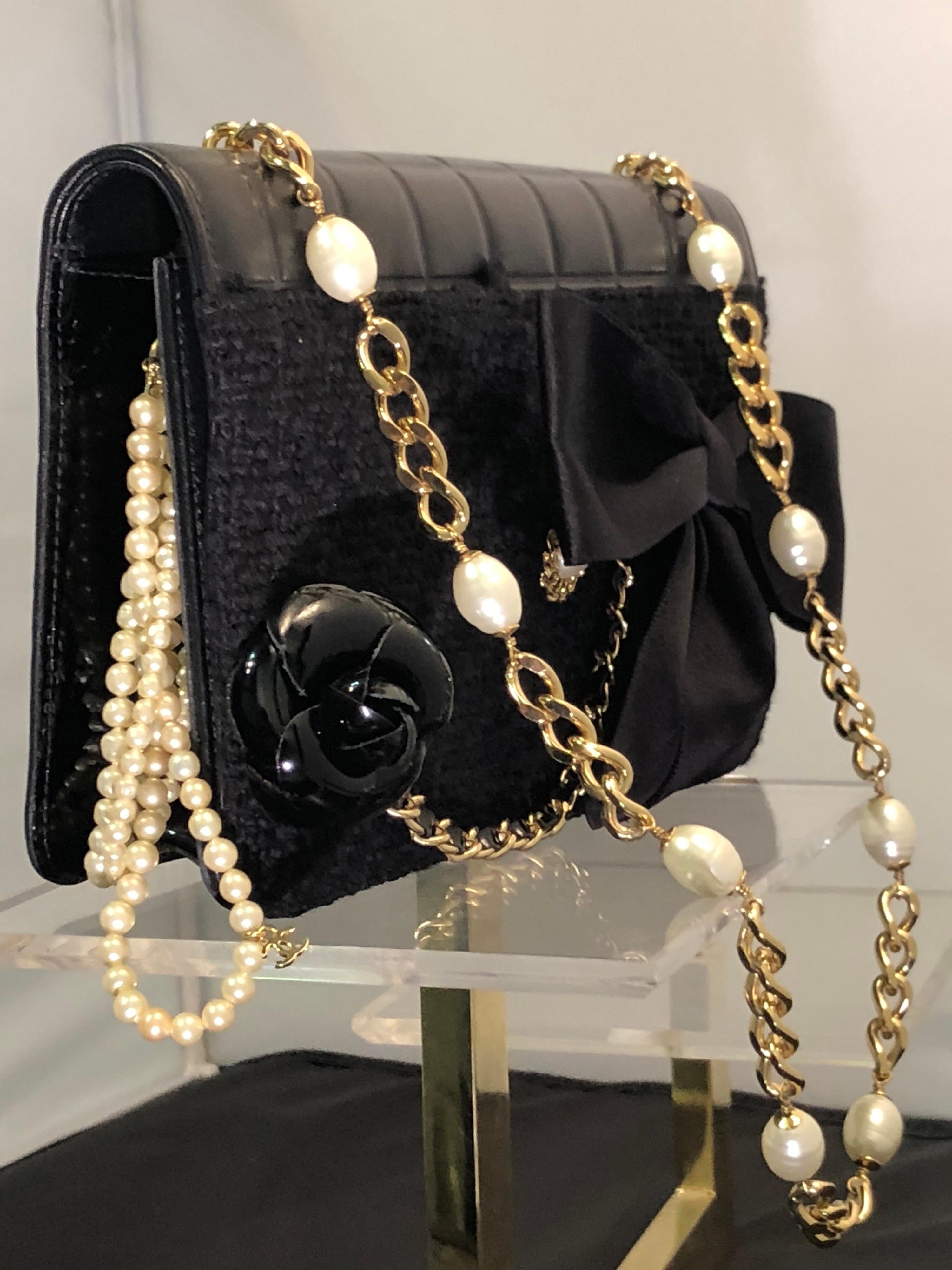 Women's Chanel Black Boucle / Kid Leather Handbag with Camellia and CC Pearls