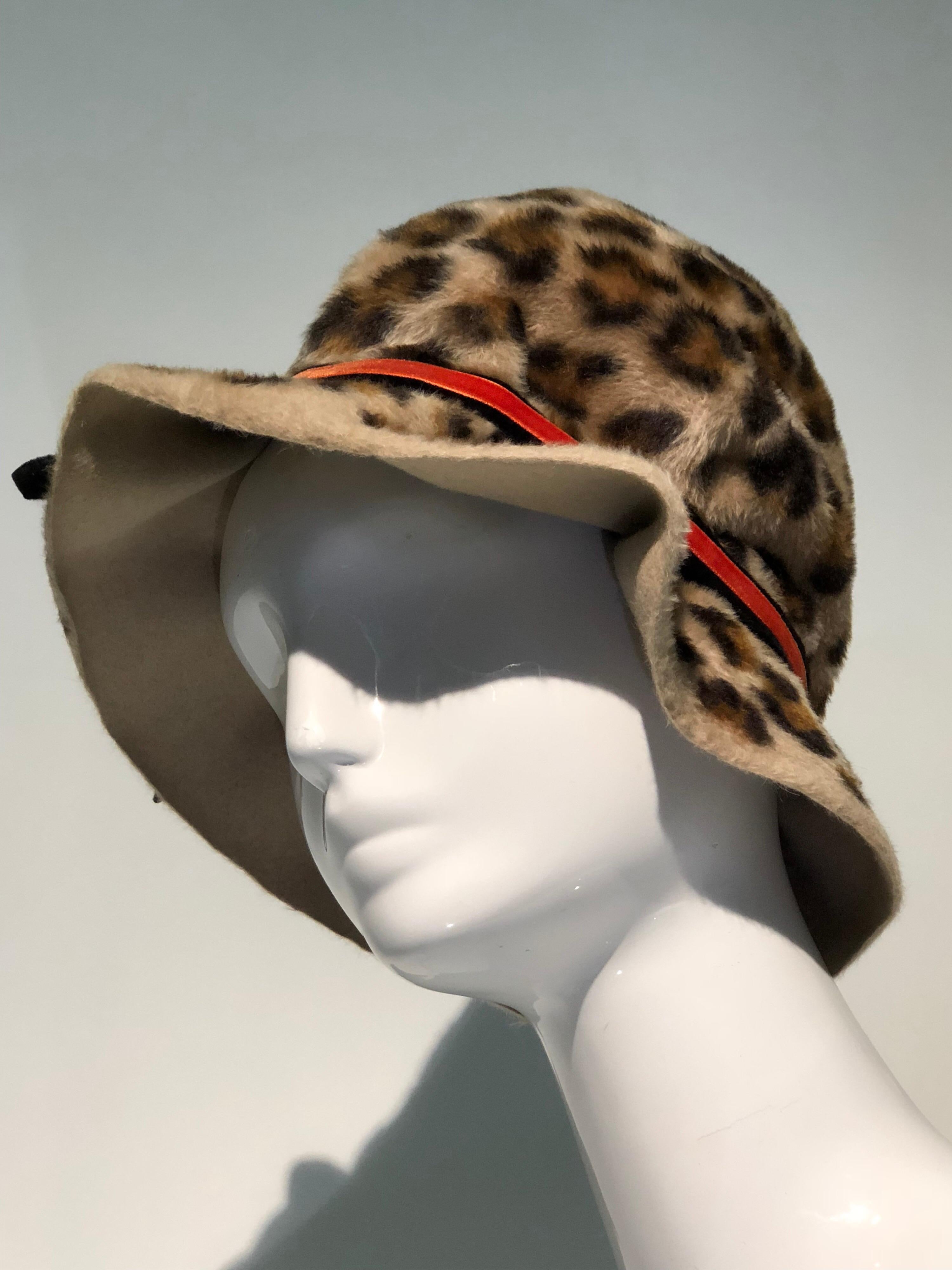 1960s Mr. John Jr. faux leopard Mod bucket hat with soft construction and orange/black band. Designed for the young woman of the 1960s, this statement piece is so wearable! 