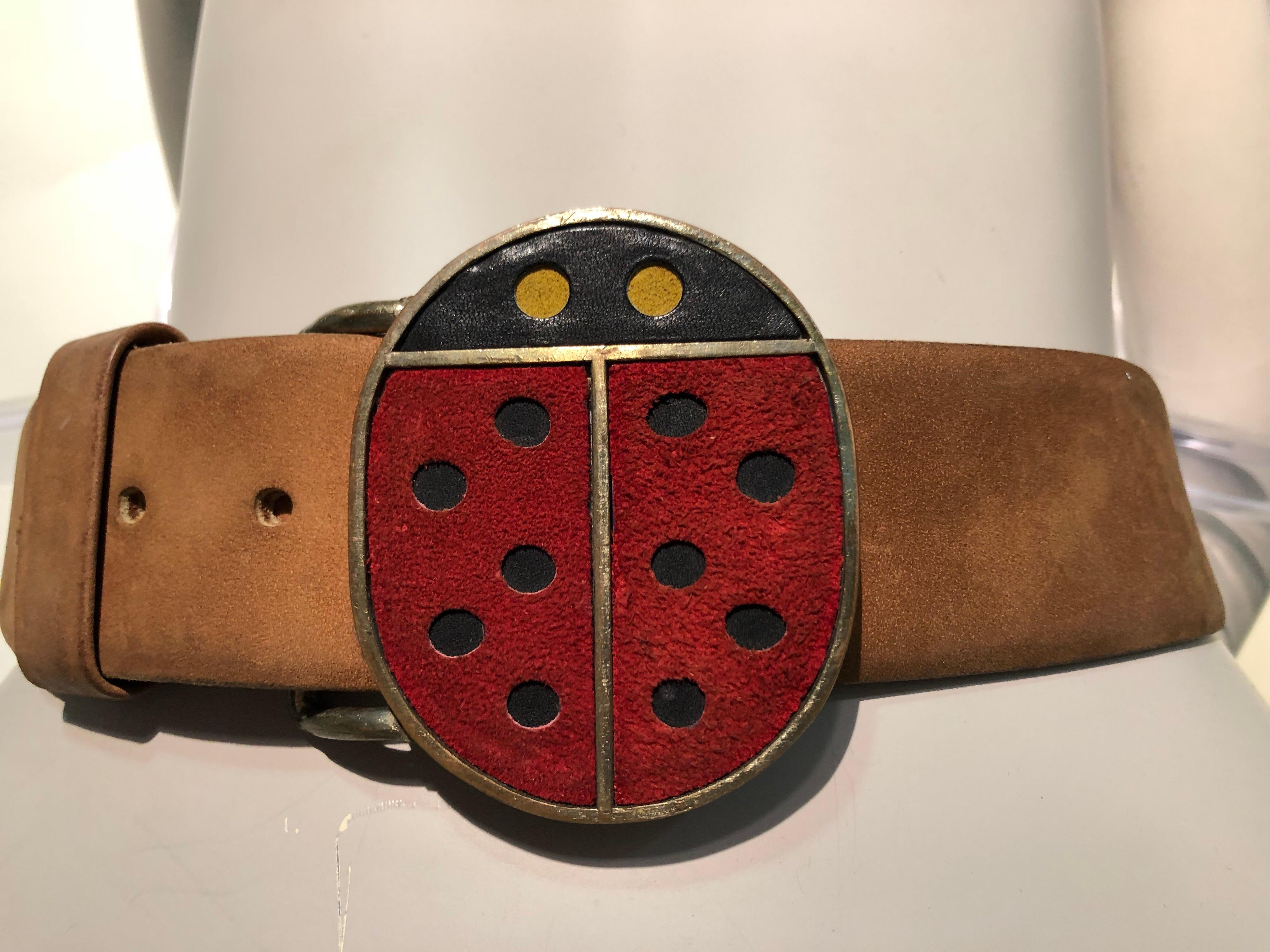 An adorable 1960s Vera Mod ladybug metal and suede belt buckle with original brown beveled-edge leather belt. Size Small. 
A 