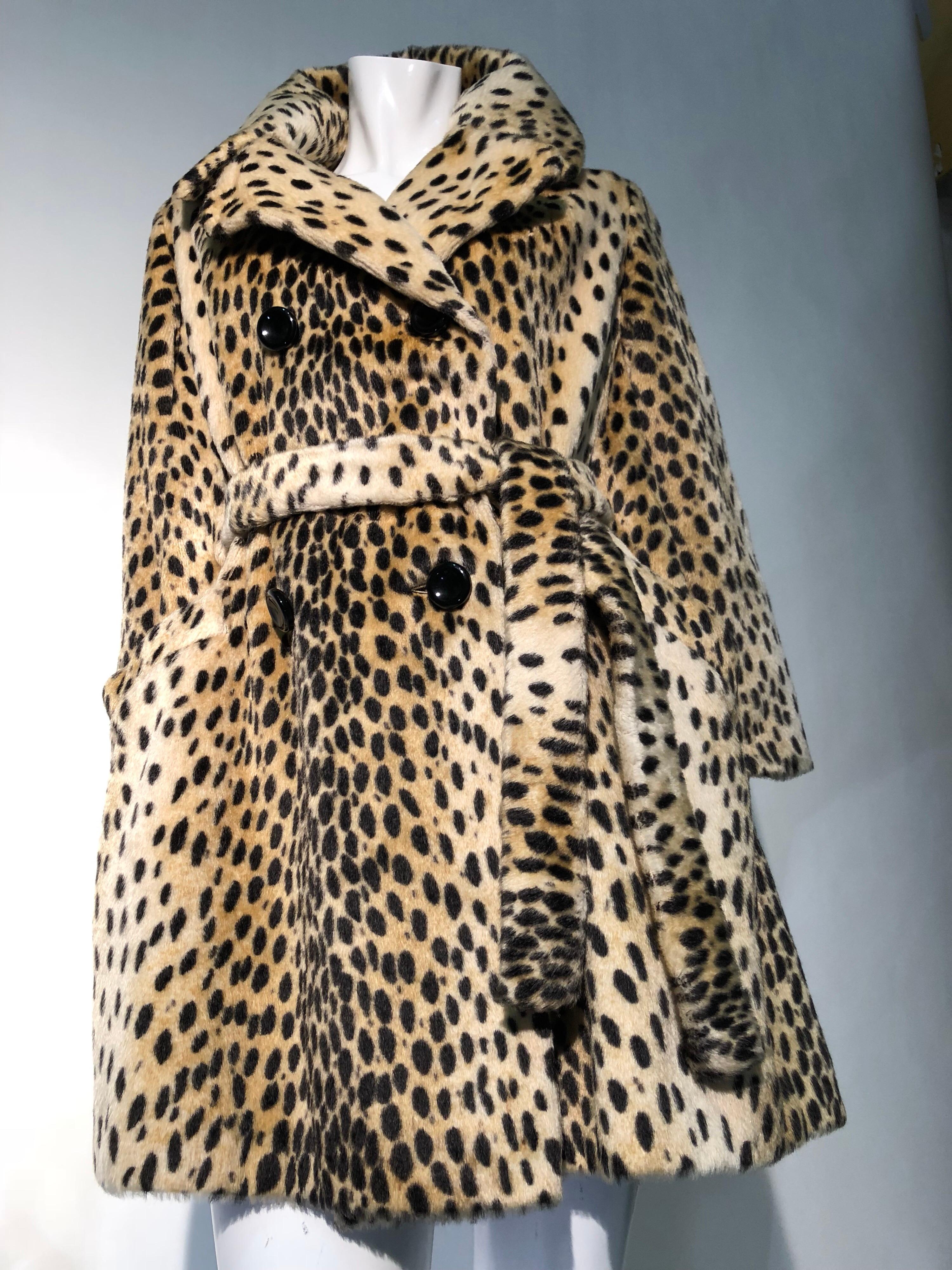 A 1960s Safari brand faux cheetah fur, double-breasted, trench-style coat. Imported La France fabric. Black buttons, acetate satin lining and original belt that can be secured around just the front of coat, leaving back free. So chic!  