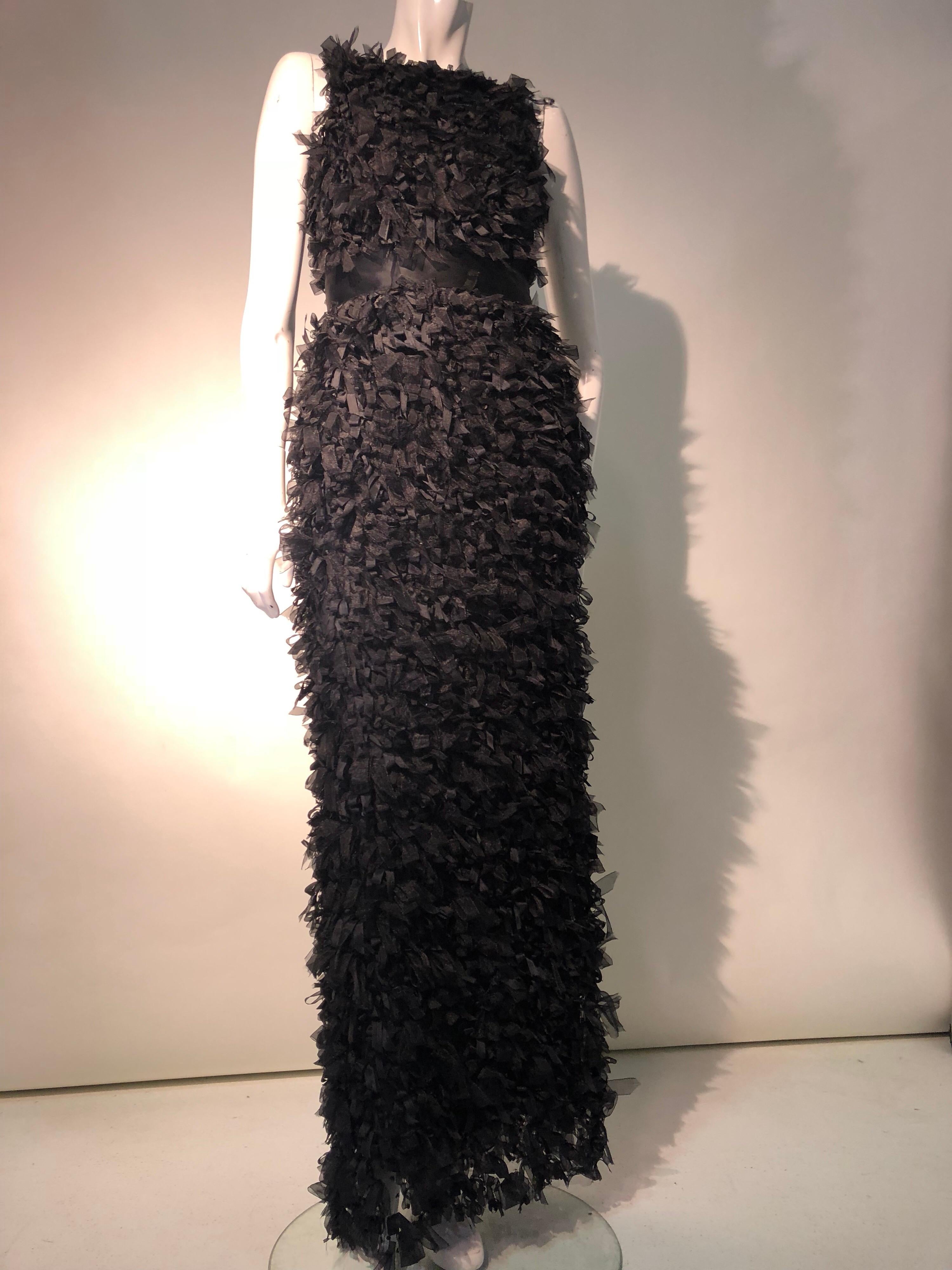 A fabulous Oscar de La Renta black sleeveless silk sheath dress entirely covered with silk ribbon confetti fringe!  The keyhole at back of neck can be small or opened larger (as shown). Wide silk grosgrain ribbon waistband with bow at back. Deep