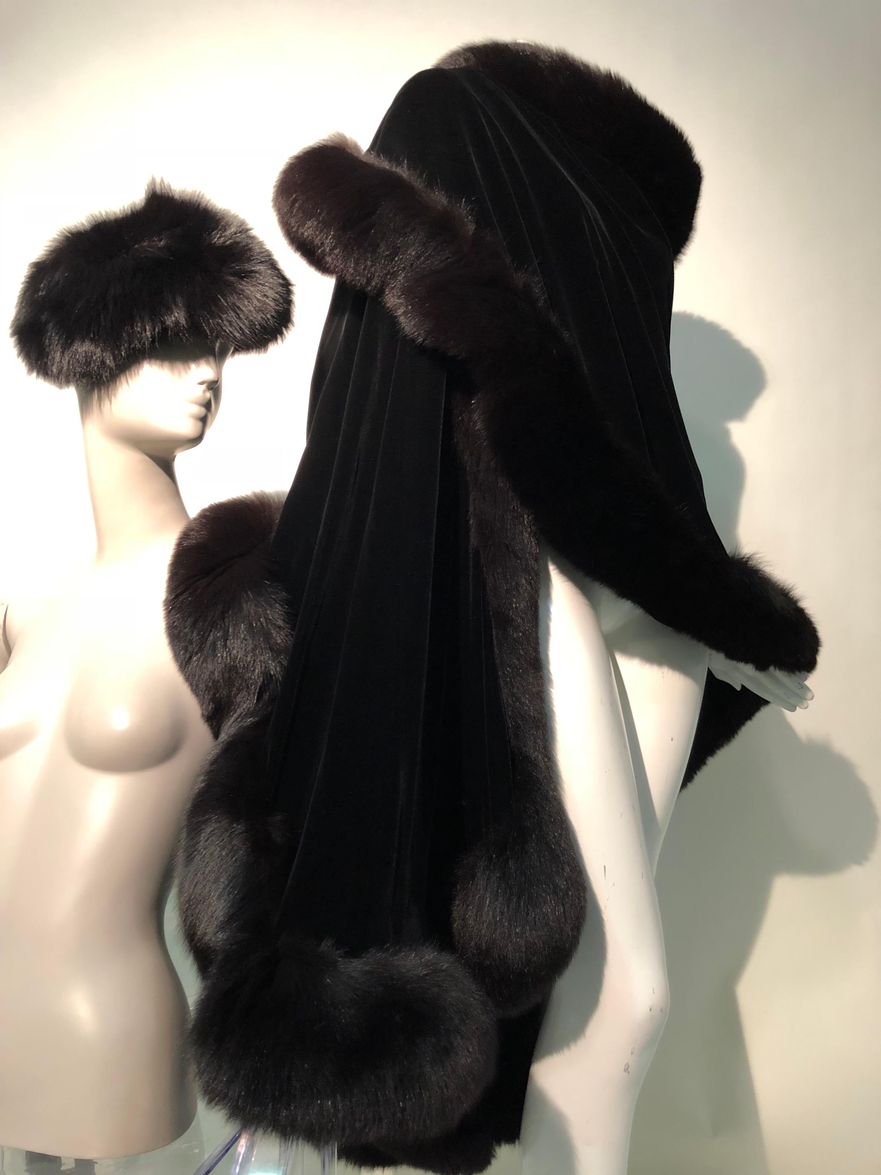 These two Halston original pieces from different eras of Halston`s career make a striking ensemble:  a 1970s double-sided silk velvet stole trimmed in plush fox fur is luxurious and generous in proportion. The 1960s genuine fox fur hat is an example