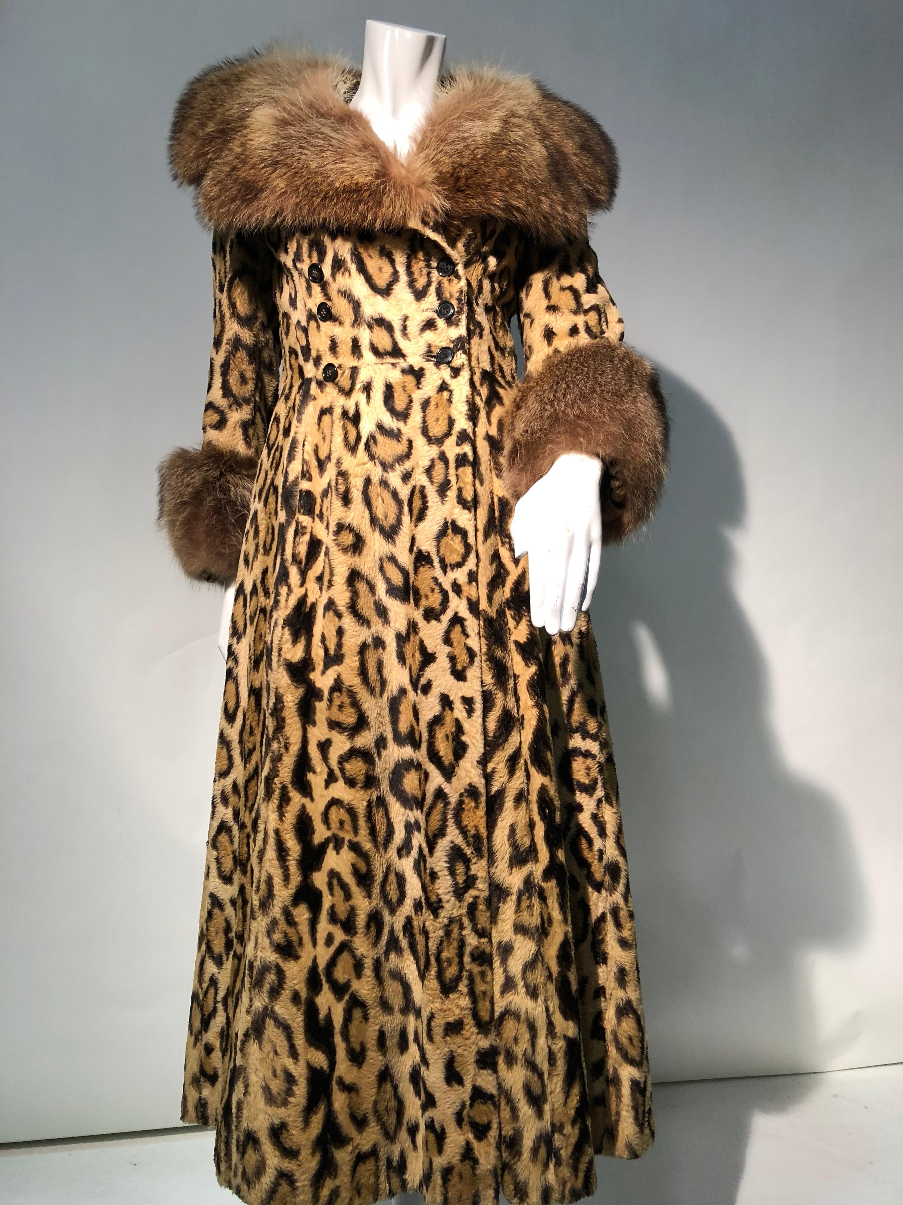 A fabulous 1970s full length faux leopard fur princess coat with double-breasted buttons and wide, notched genuine racoon fur collar and cuffs. A high quality realistic faux leopard fur makes this piece a stunning addition to your winter wardrobe!