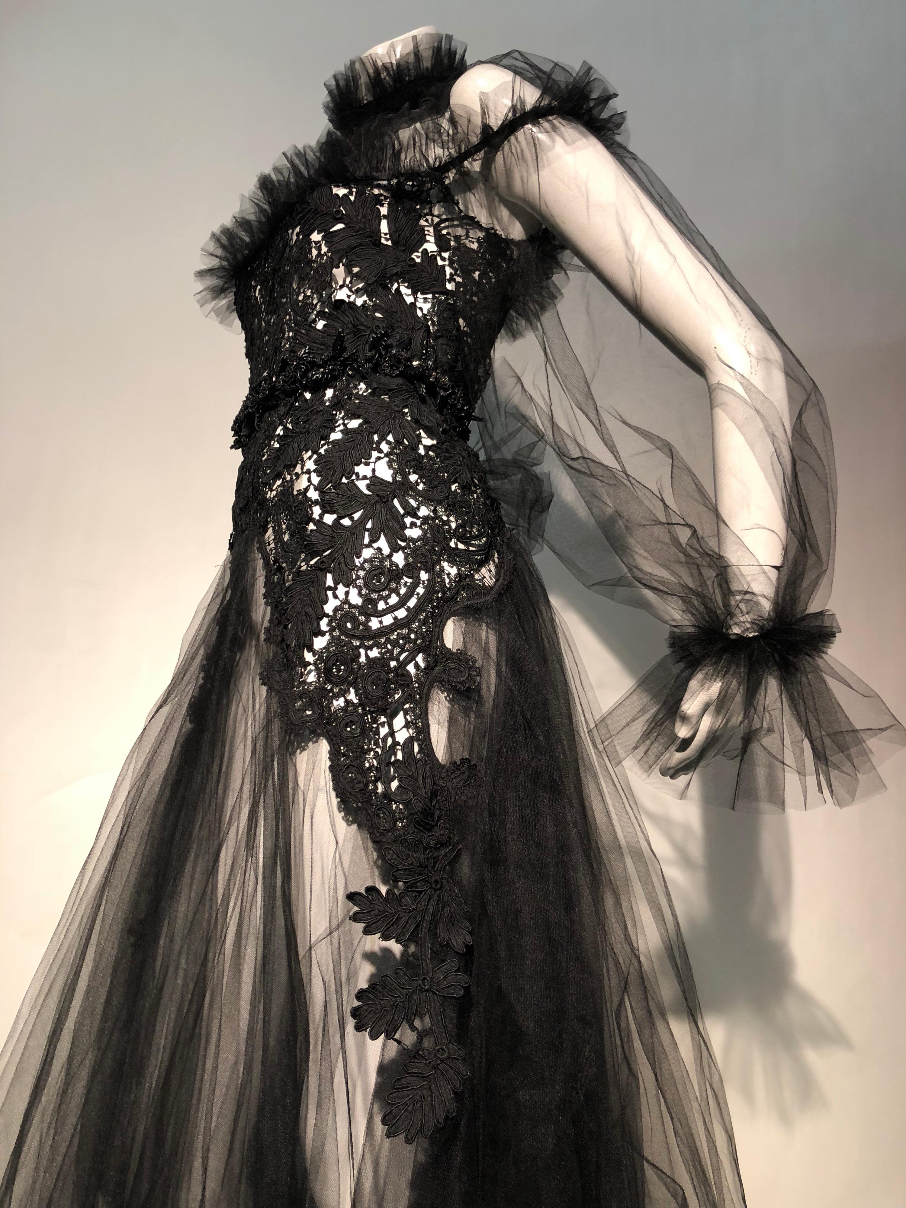 Torso Creations, Victorian hand-made cord lace and tulle are paired in a high collar goth-style gown with sash. Be as daring as you like in this whirl of diaphanous tulle. Ruffles frame the neck decolletage and full skirt in the extraordinarily