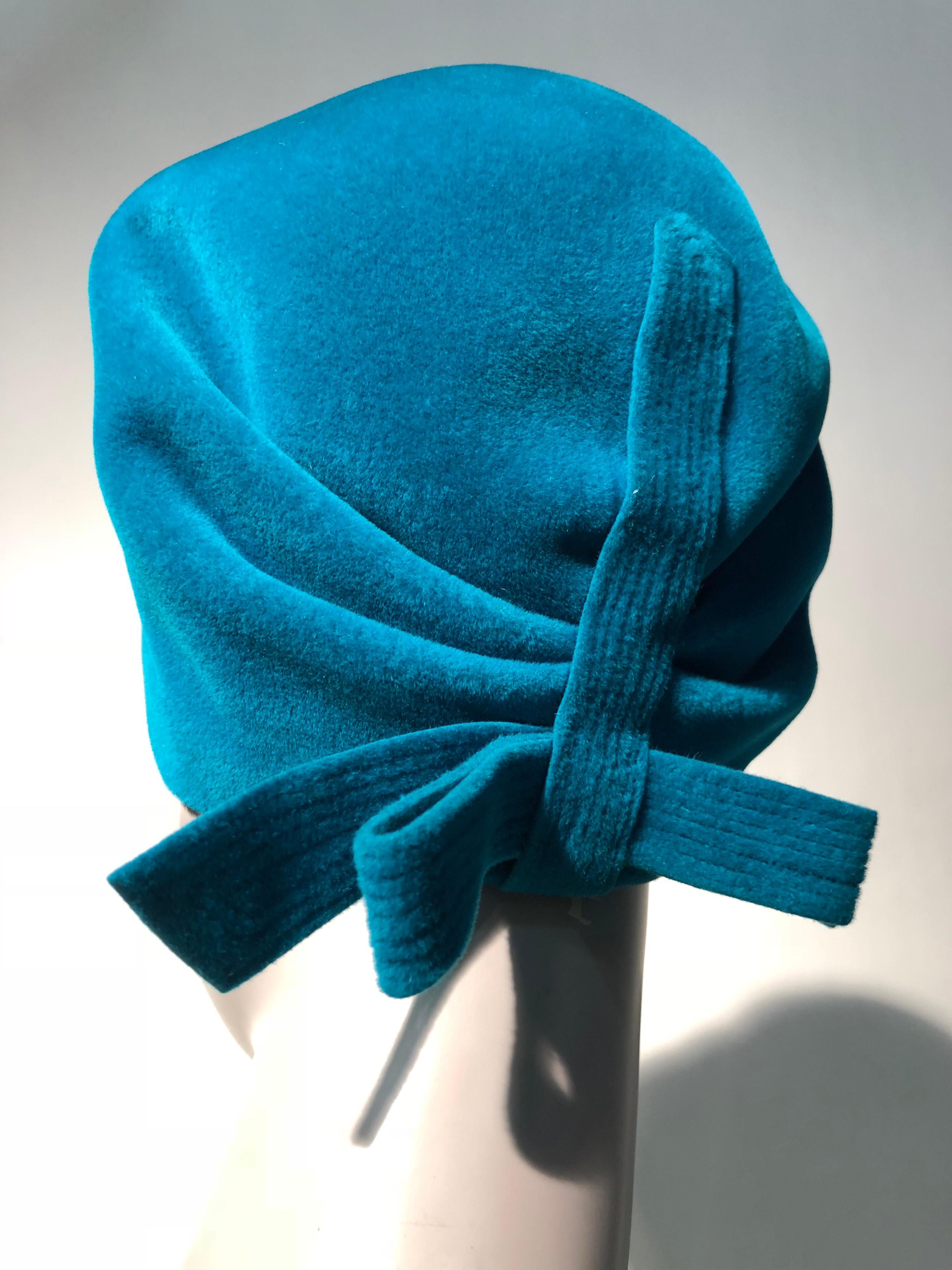 A beautiful 1960s Hubert de Givenchy Mod bubble hat in azure blue fur velour hat with a large fixed bow at back and tucks at front of crown.