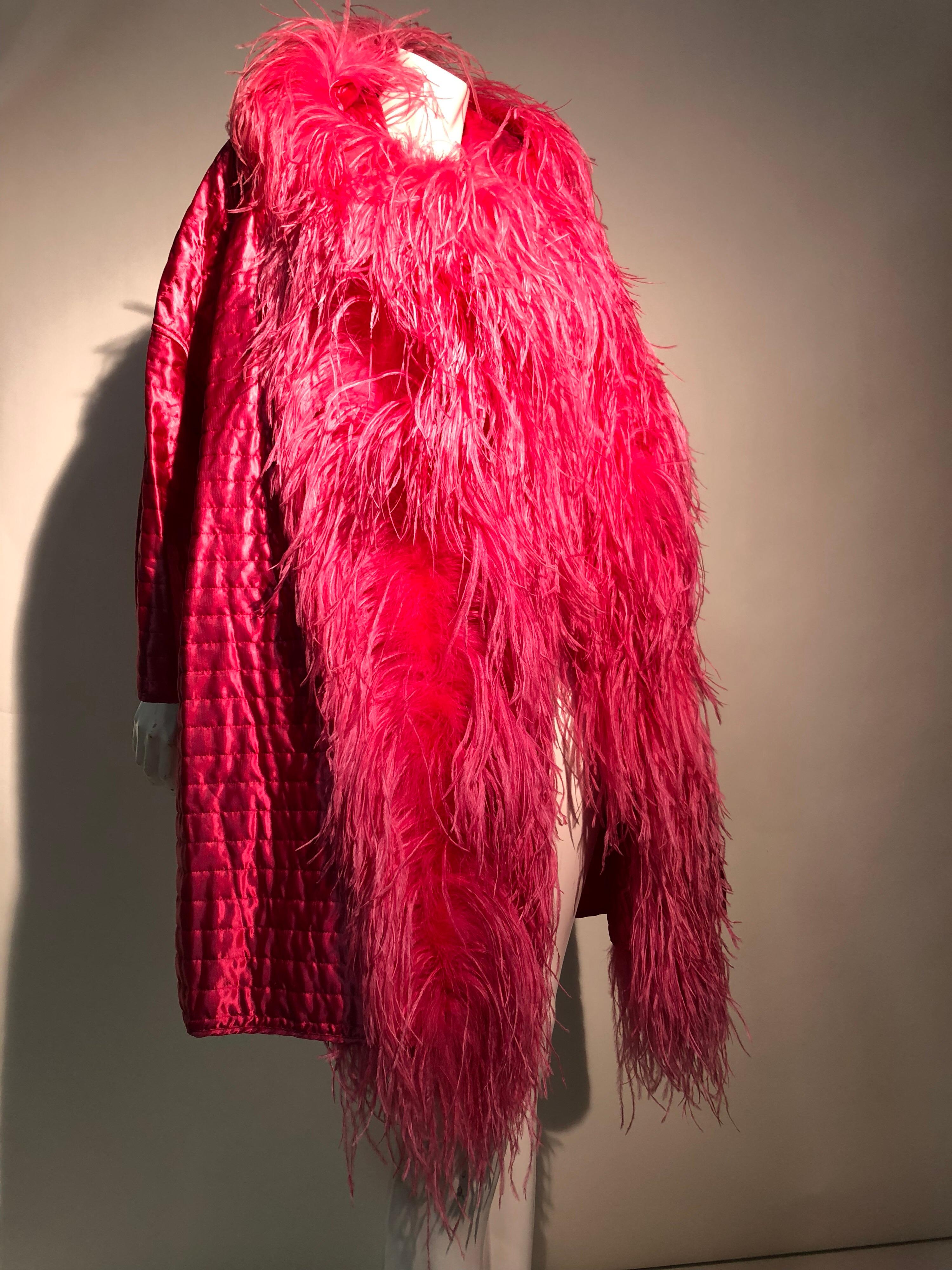 A stunning 1990s Gianfranco Ferré hot pink quilted silk cocoon coat with drop shoulders and a huge, cascading collar of languid ostrich feathers. No front closures. Wow!!!