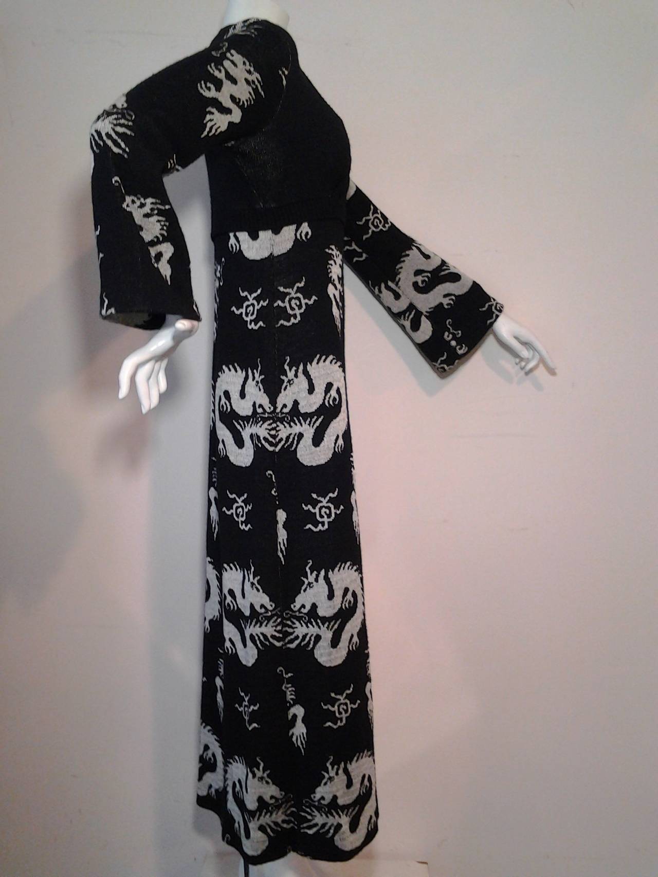 1970s Giorgio Sant Angelo kimono-inspired knit empire waist maxi dress.  Wrap neckline, flared cuffs, and side slit.  Fabulous dragon motif knitted in overall.